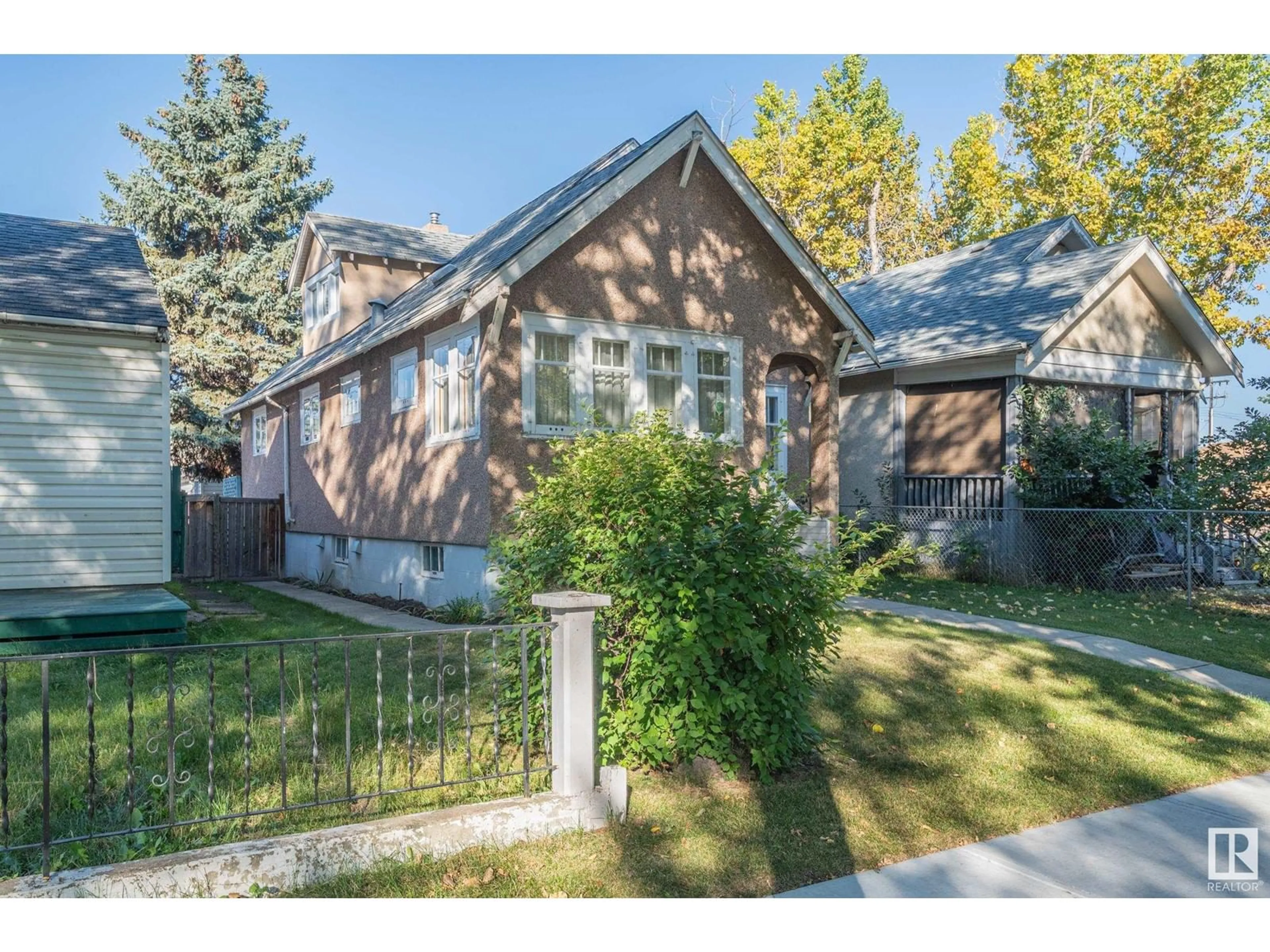 Frontside or backside of a home, the fenced backyard for 11646 94 ST NW, Edmonton Alberta T5G1H8