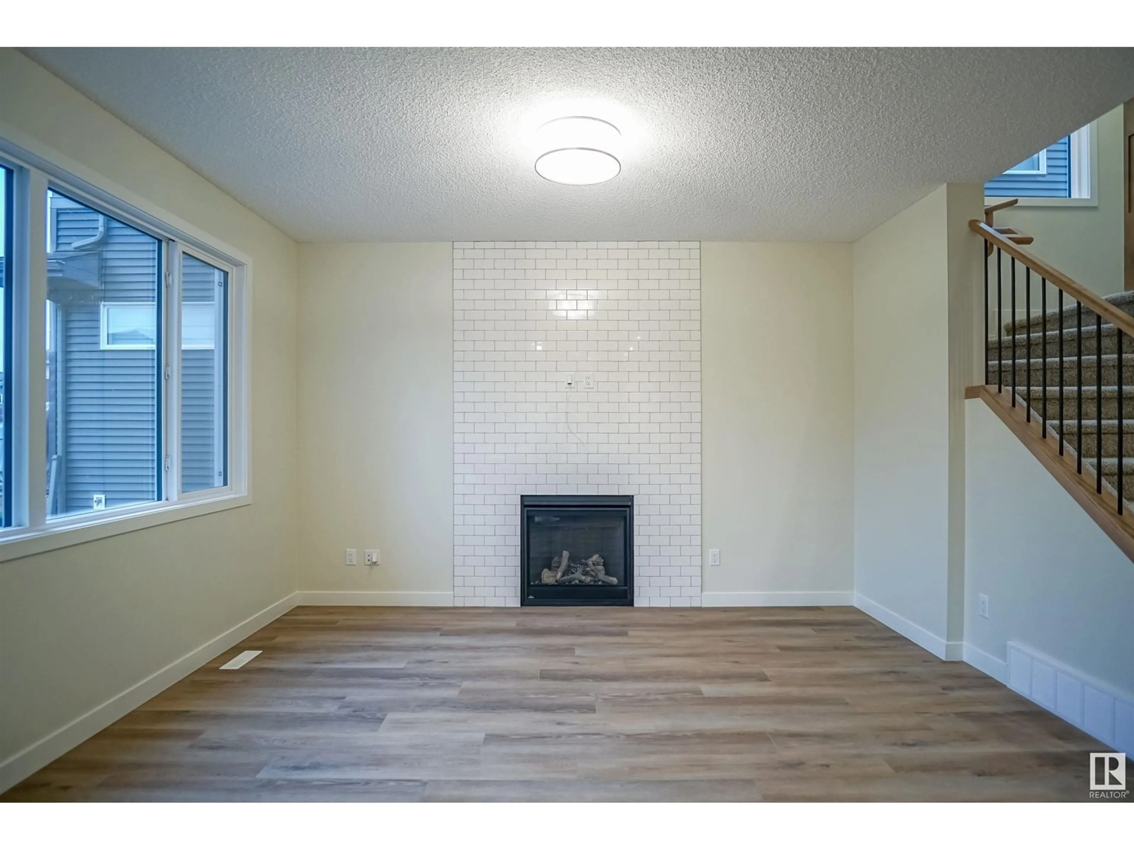 A pic of a room, wood floors for 1233 16A AV NW, Edmonton Alberta T6T2V1