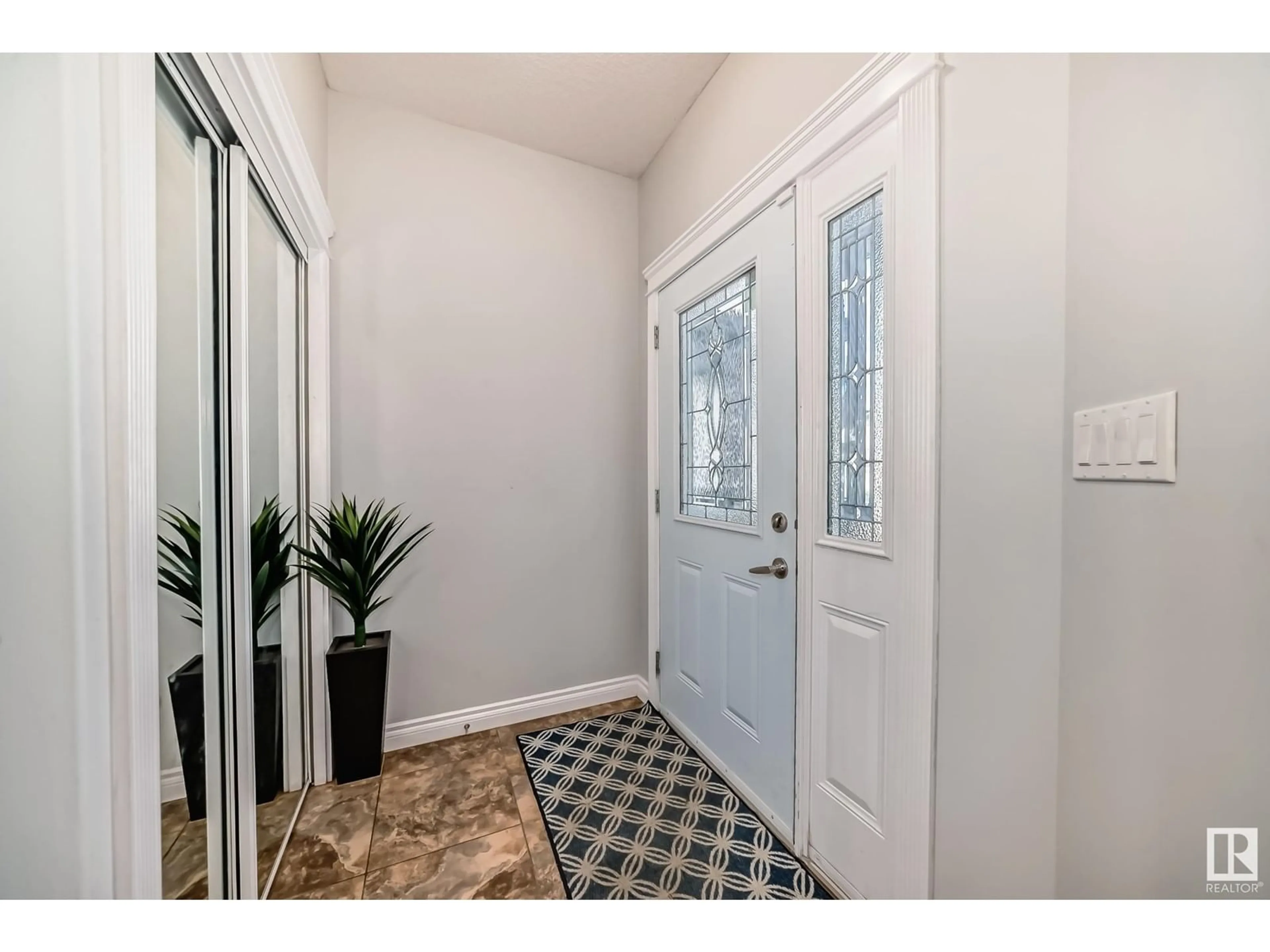 Indoor entryway, wood floors for 16911 54 ST NW, Edmonton Alberta T5Y0R2