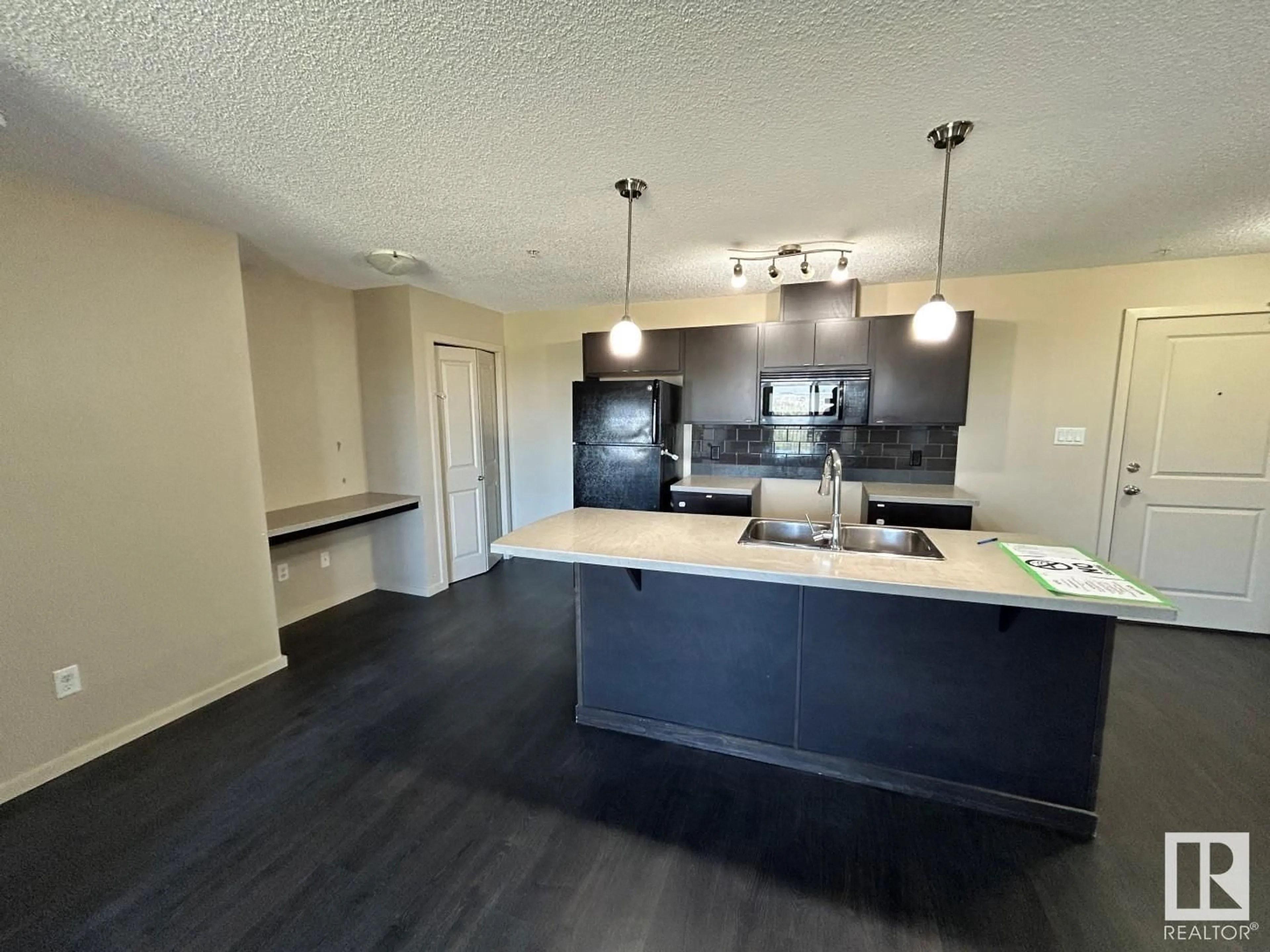 Open concept kitchen for #361 1196 HYNDMAN RD NW, Edmonton Alberta T5A0X8