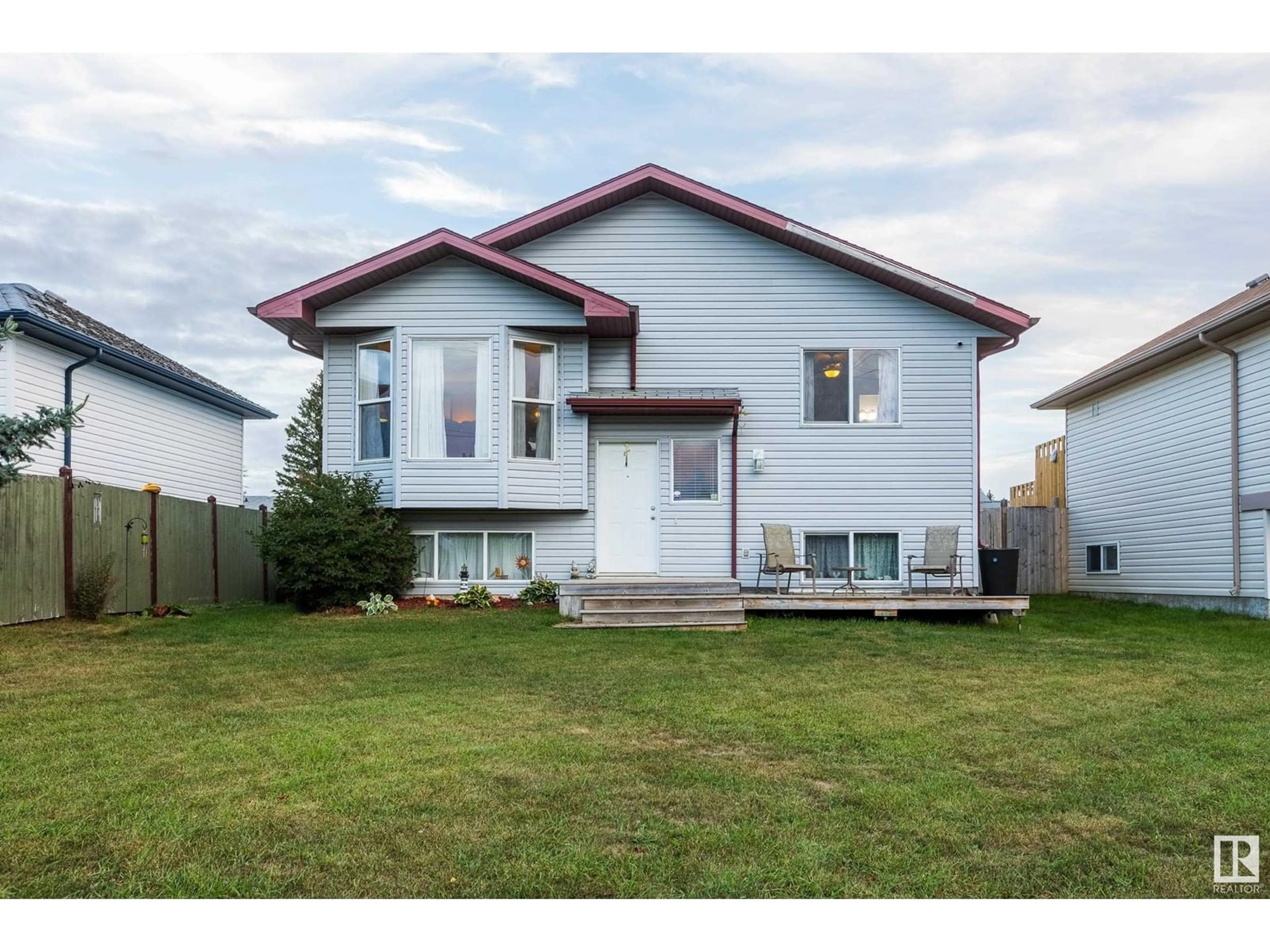 Frontside or backside of a home, the street view for 33 Spruce Meadow LN, Bon Accord Alberta T0A0K0