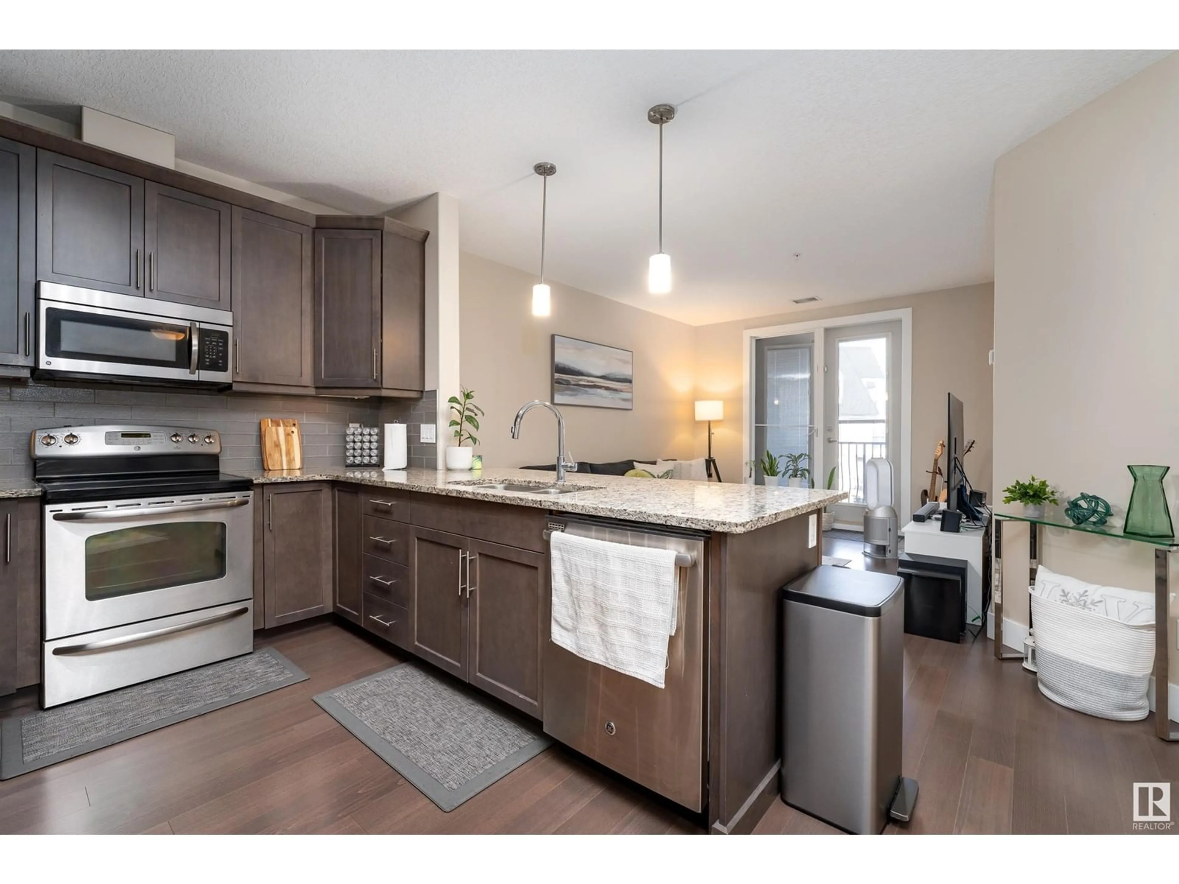 Open concept kitchen for #347 6079 MAYNARD WY NW, Edmonton Alberta T6R0S4