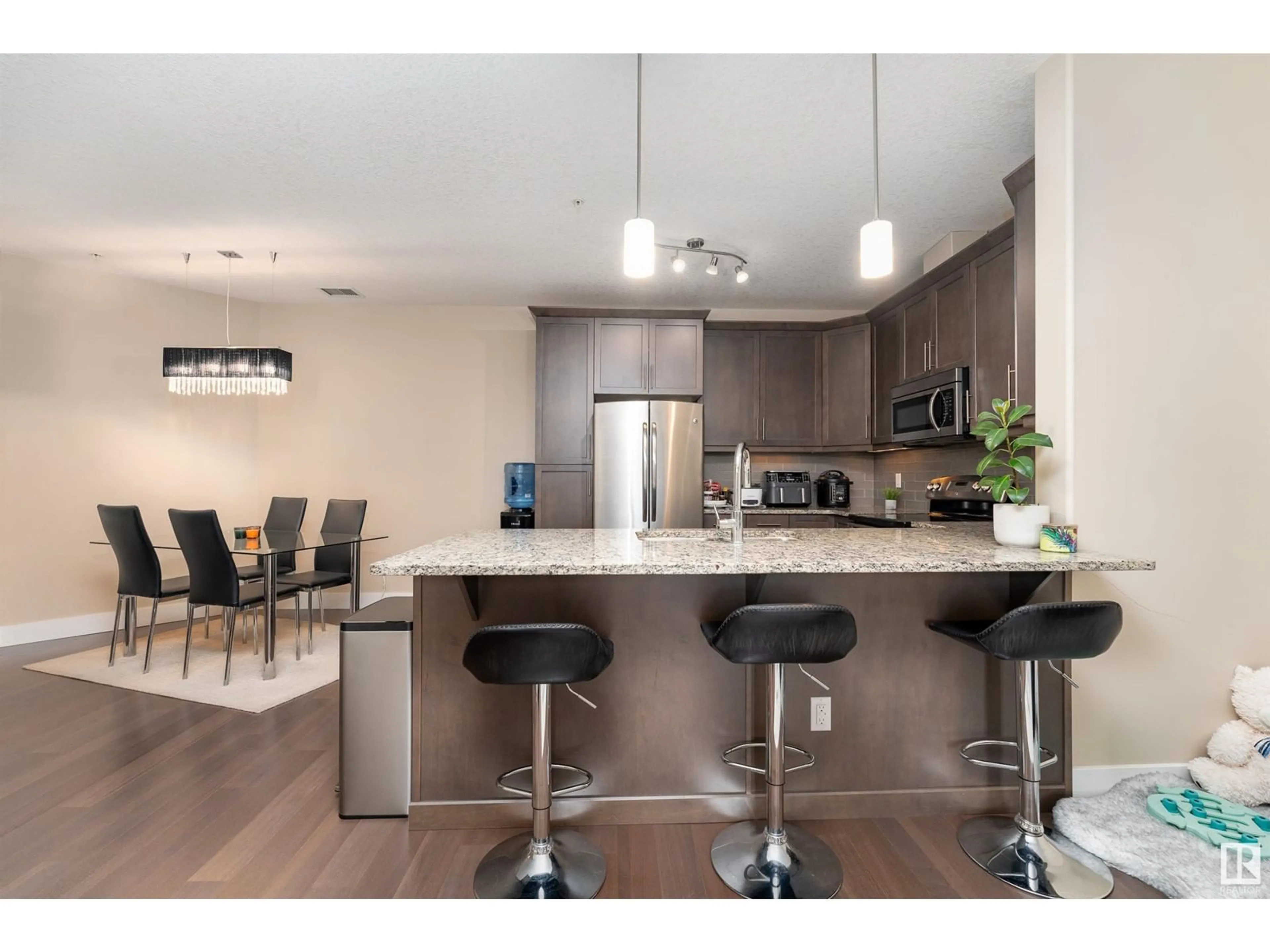 Open concept kitchen for #347 6079 MAYNARD WY NW, Edmonton Alberta T6R0S4