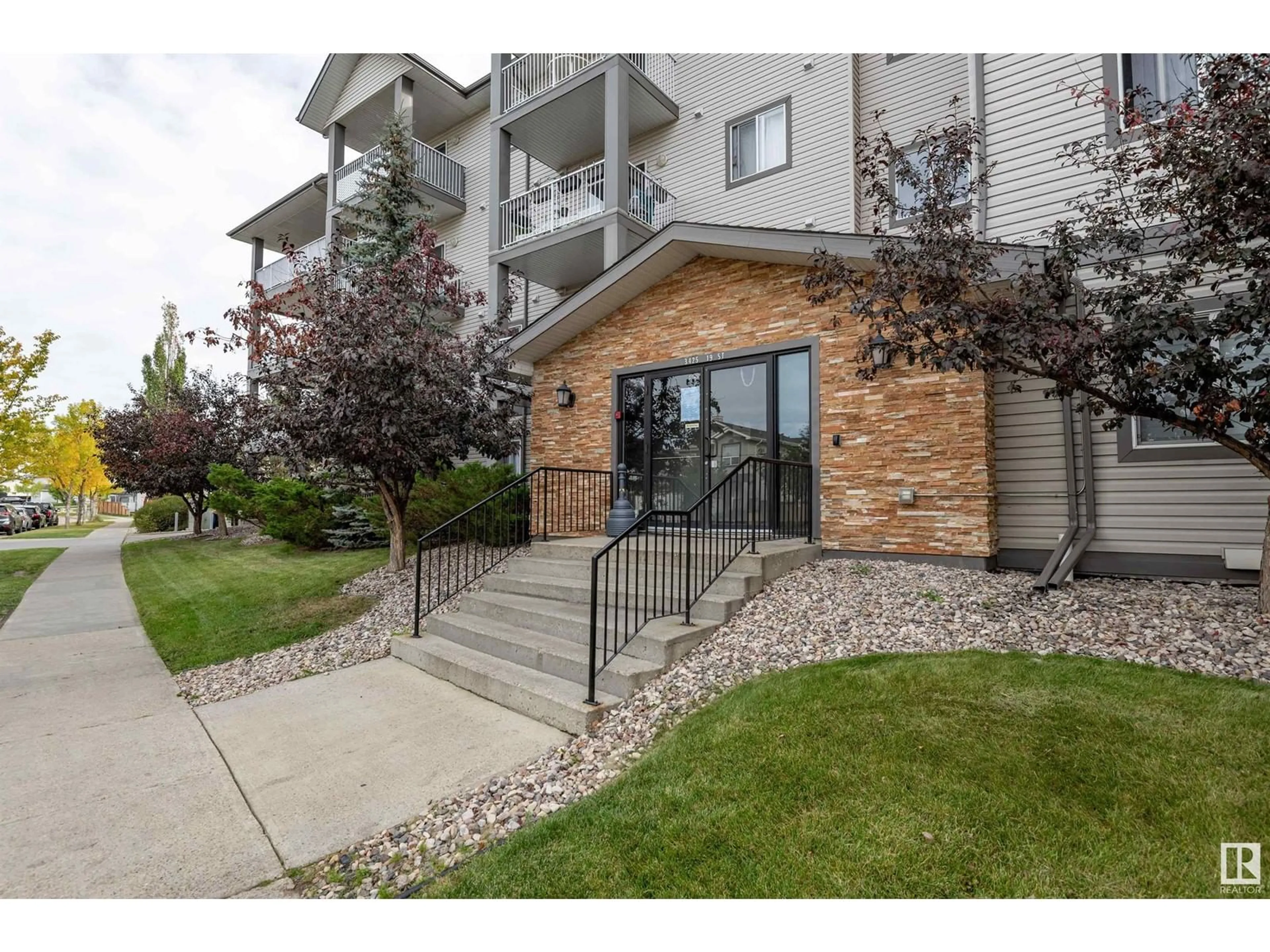 A pic from exterior of the house or condo, the front or back of building for #106 3425 19 ST NW, Edmonton Alberta T6T2B5