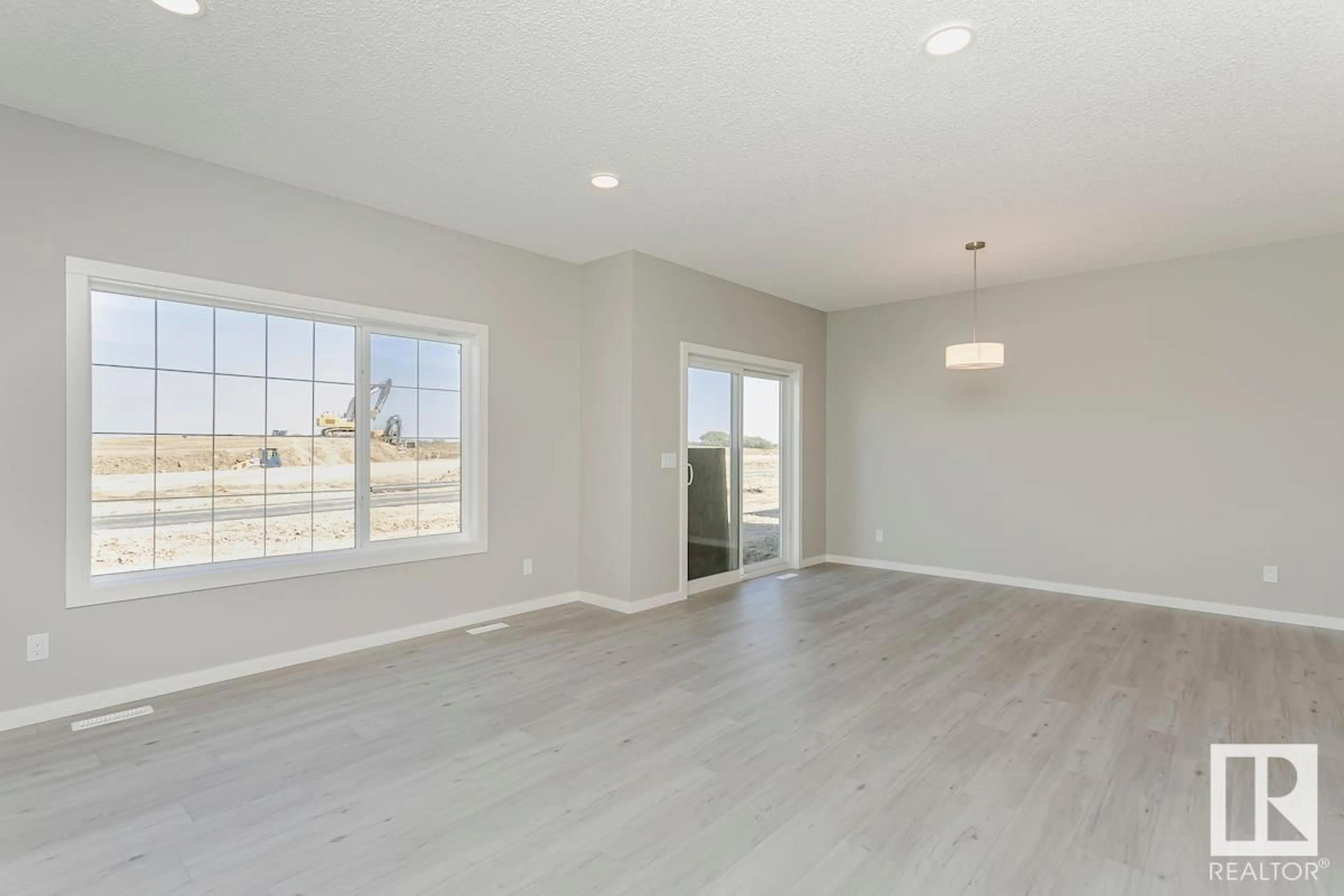 A pic of a room, wood floors for 653 KINGLET BV NW, Edmonton Alberta T5S2B9