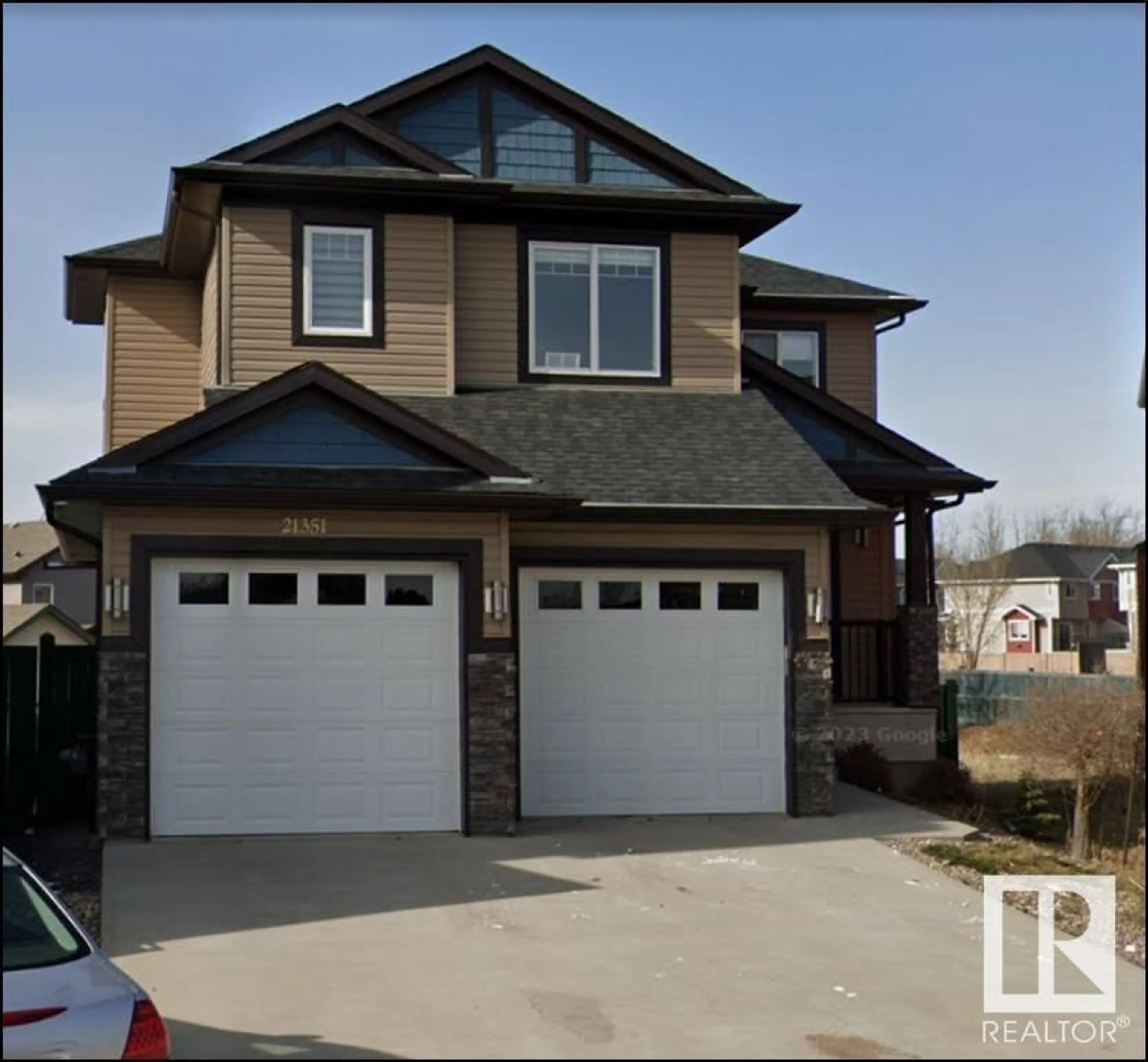 Frontside or backside of a home for 21351 96 AV NW, Edmonton Alberta T5T4M8