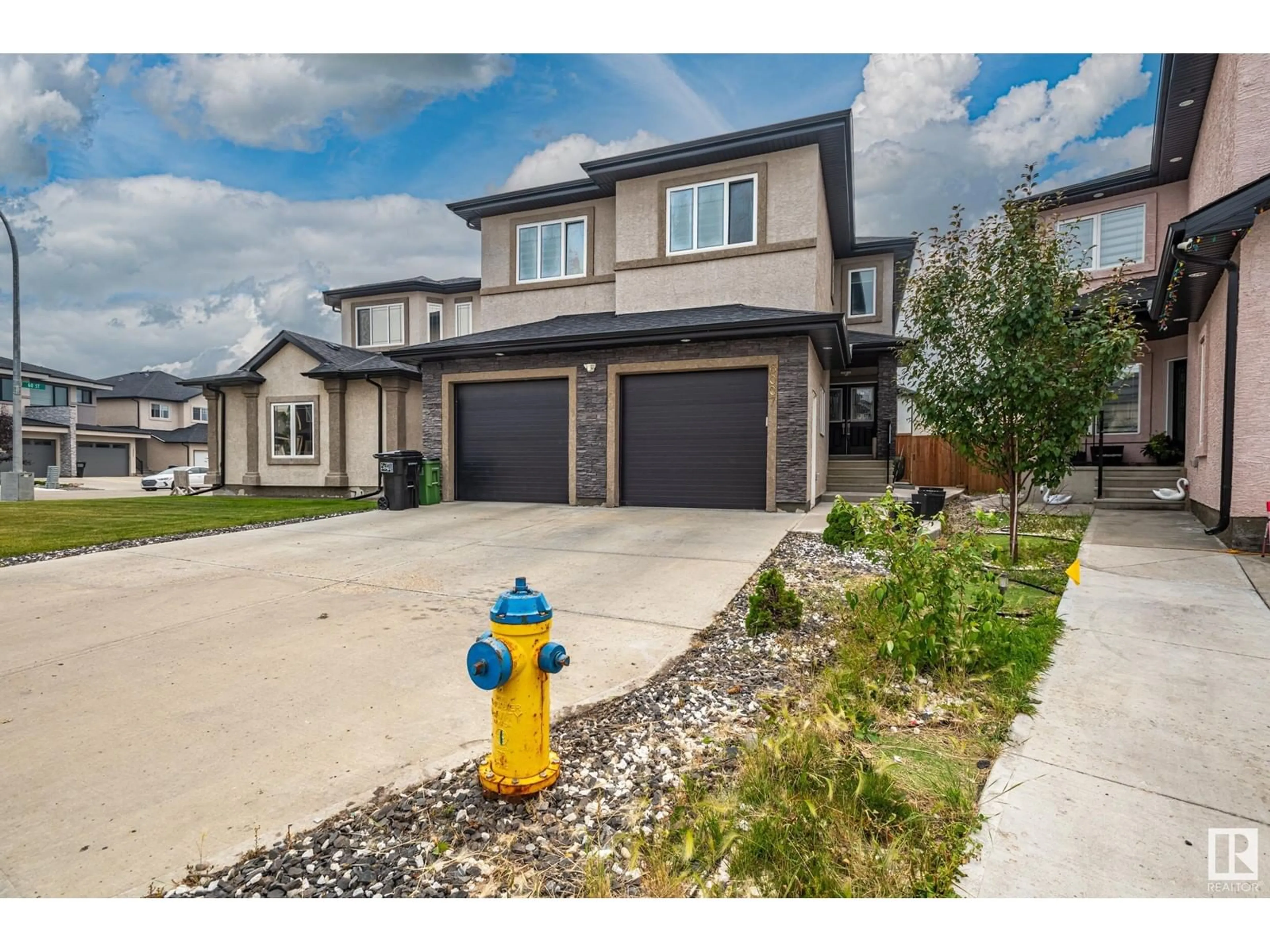 Frontside or backside of a home, the street view for 6007 171 AV NW, Edmonton Alberta T5Y3S6