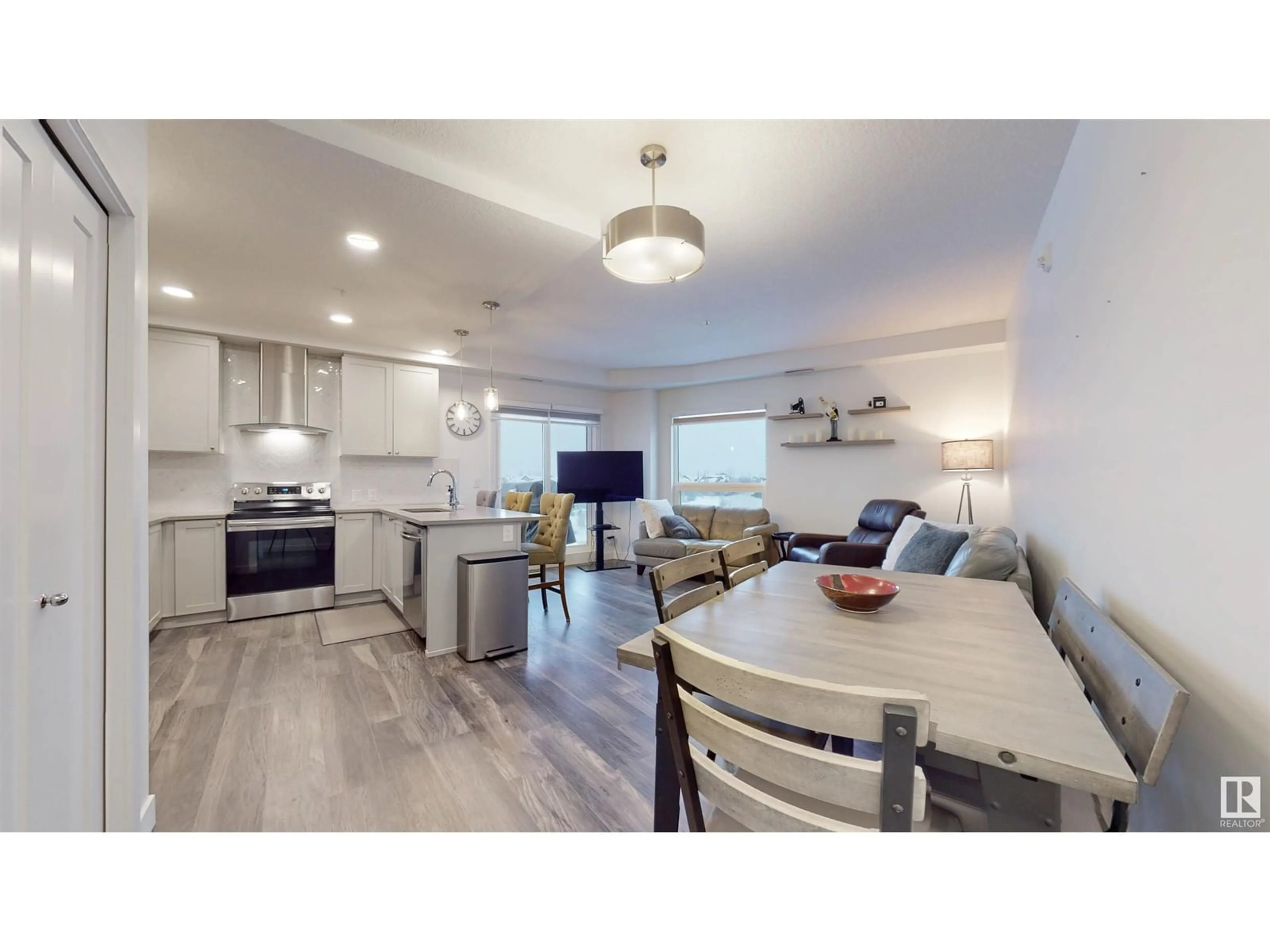 Open concept kitchen for #407 1316 WINDERMERE WY SW, Edmonton Alberta T6W2J3