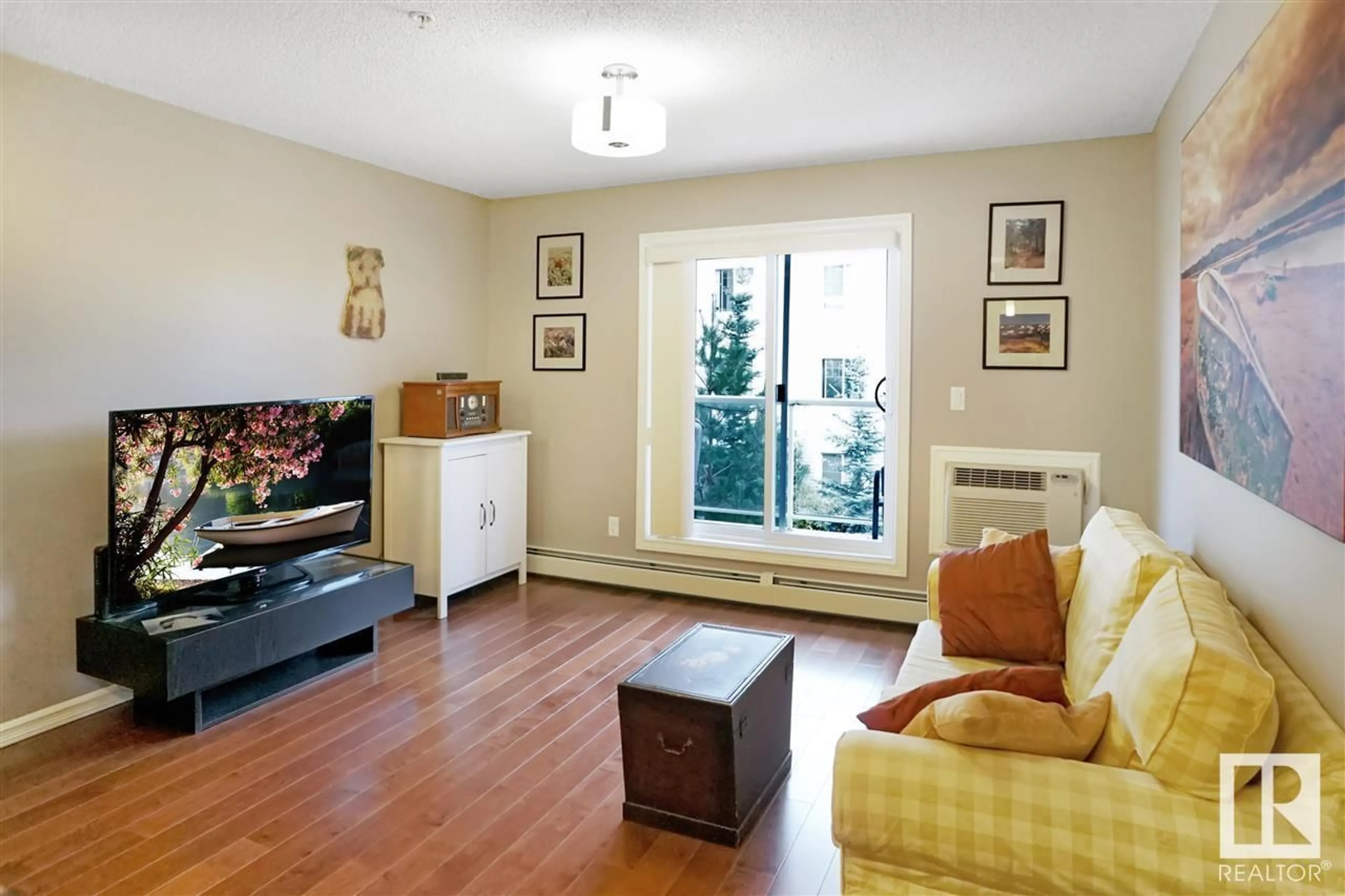 Living room, wood floors for #213 2203 44 AV NW, Edmonton Alberta T6T0T1