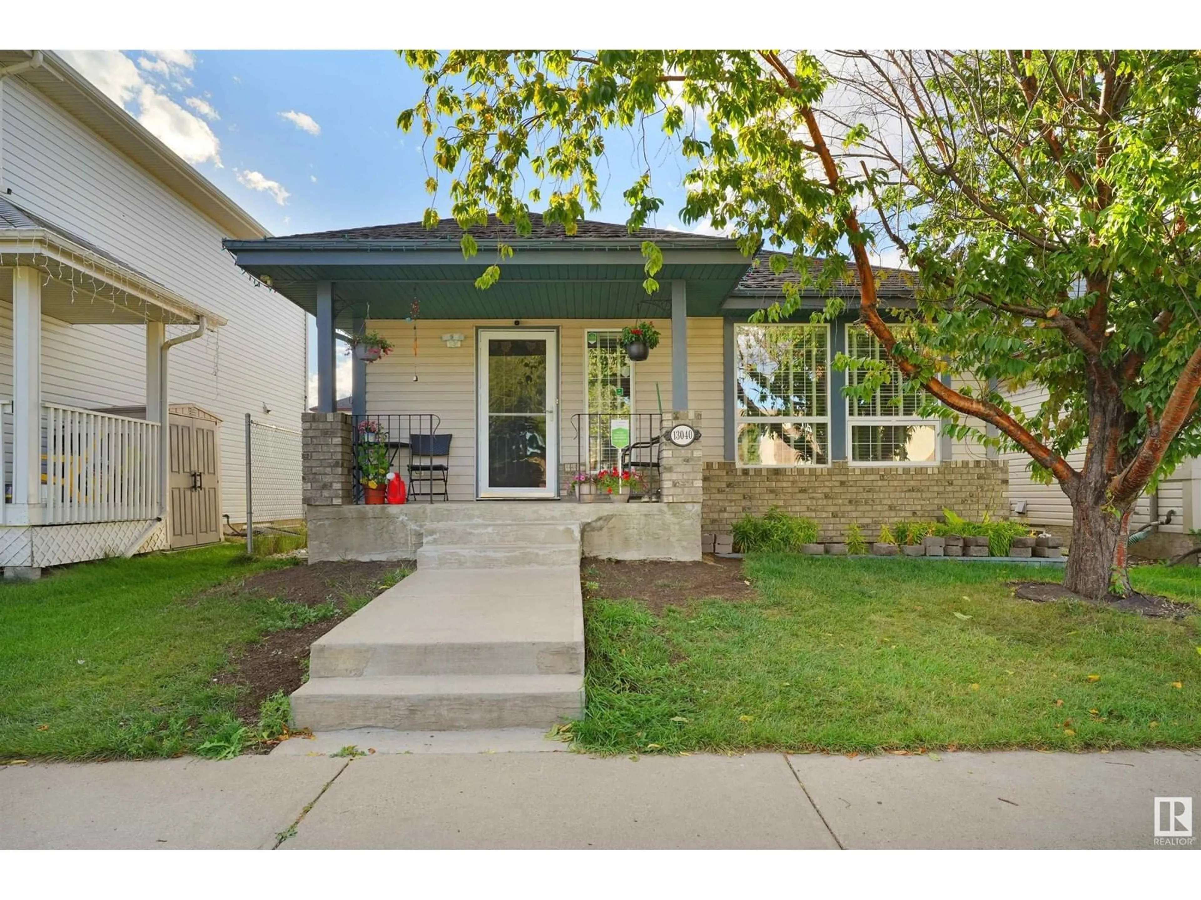 Frontside or backside of a home, the fenced backyard for 13040 34 ST NW, Edmonton Alberta T5A5G7