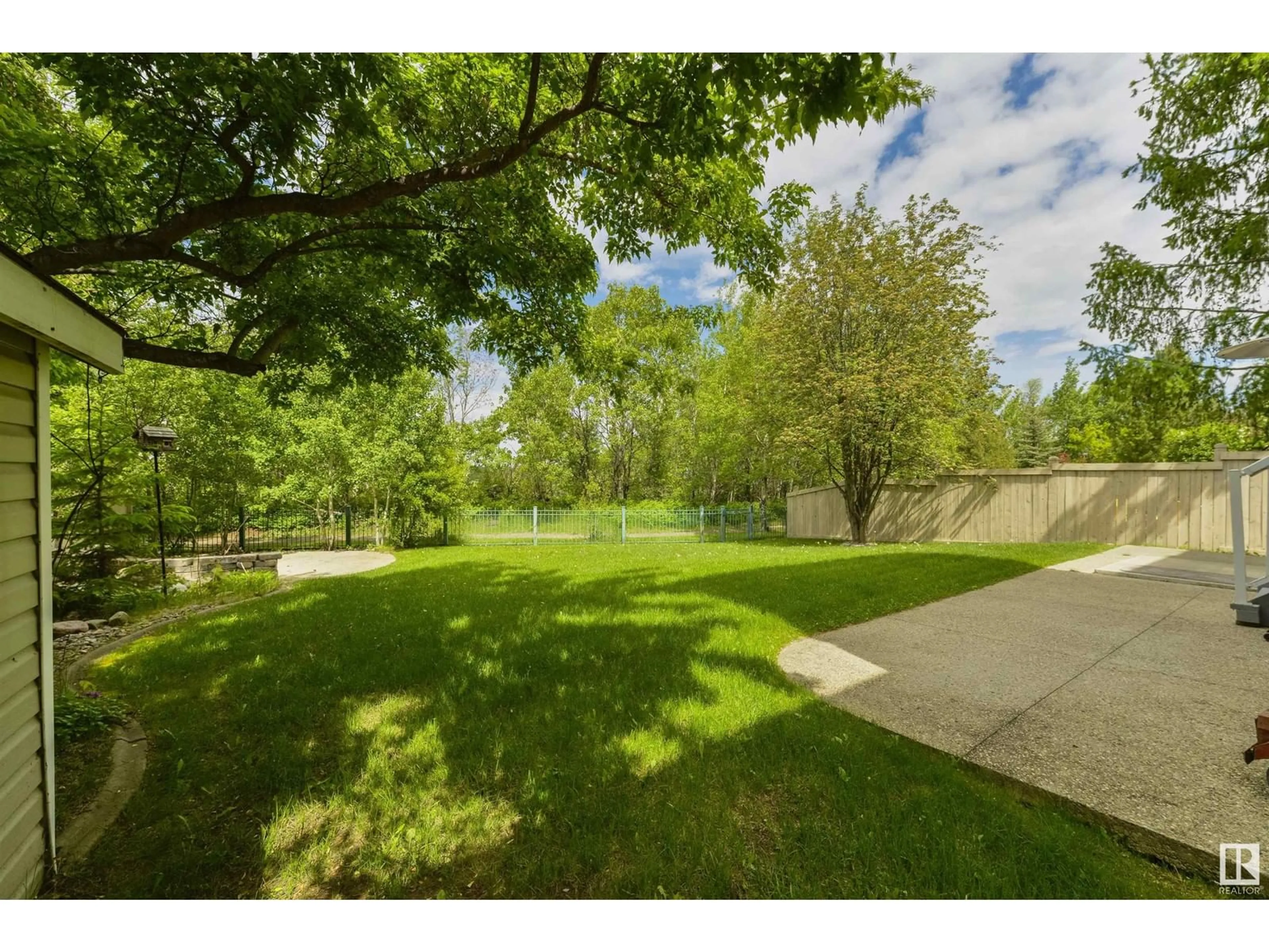 A pic from exterior of the house or condo, the fenced backyard for 873 TWIN BROOKS CL NW, Edmonton Alberta T6J7G6