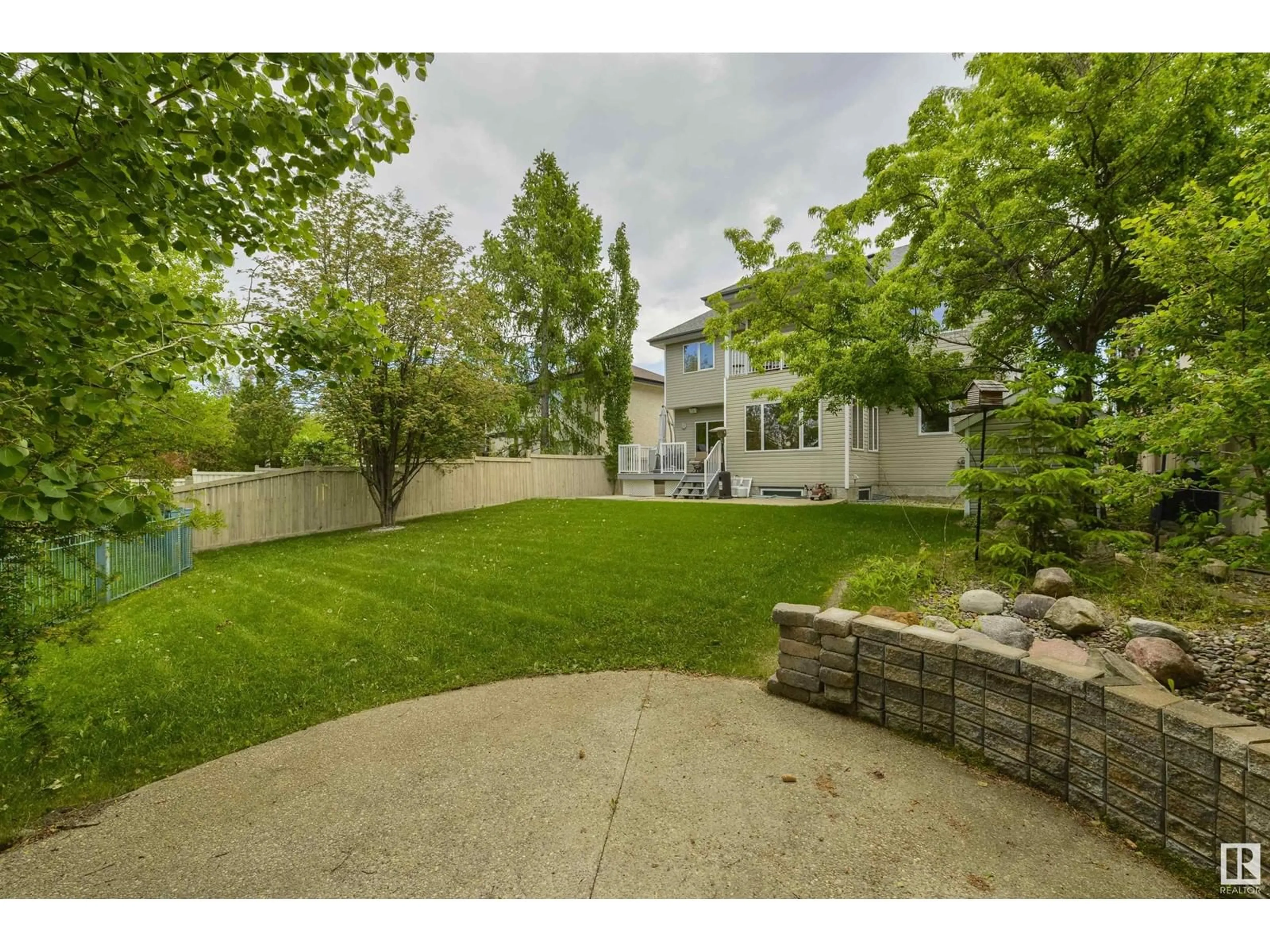 Frontside or backside of a home, the fenced backyard for 873 TWIN BROOKS CL NW, Edmonton Alberta T6J7G6