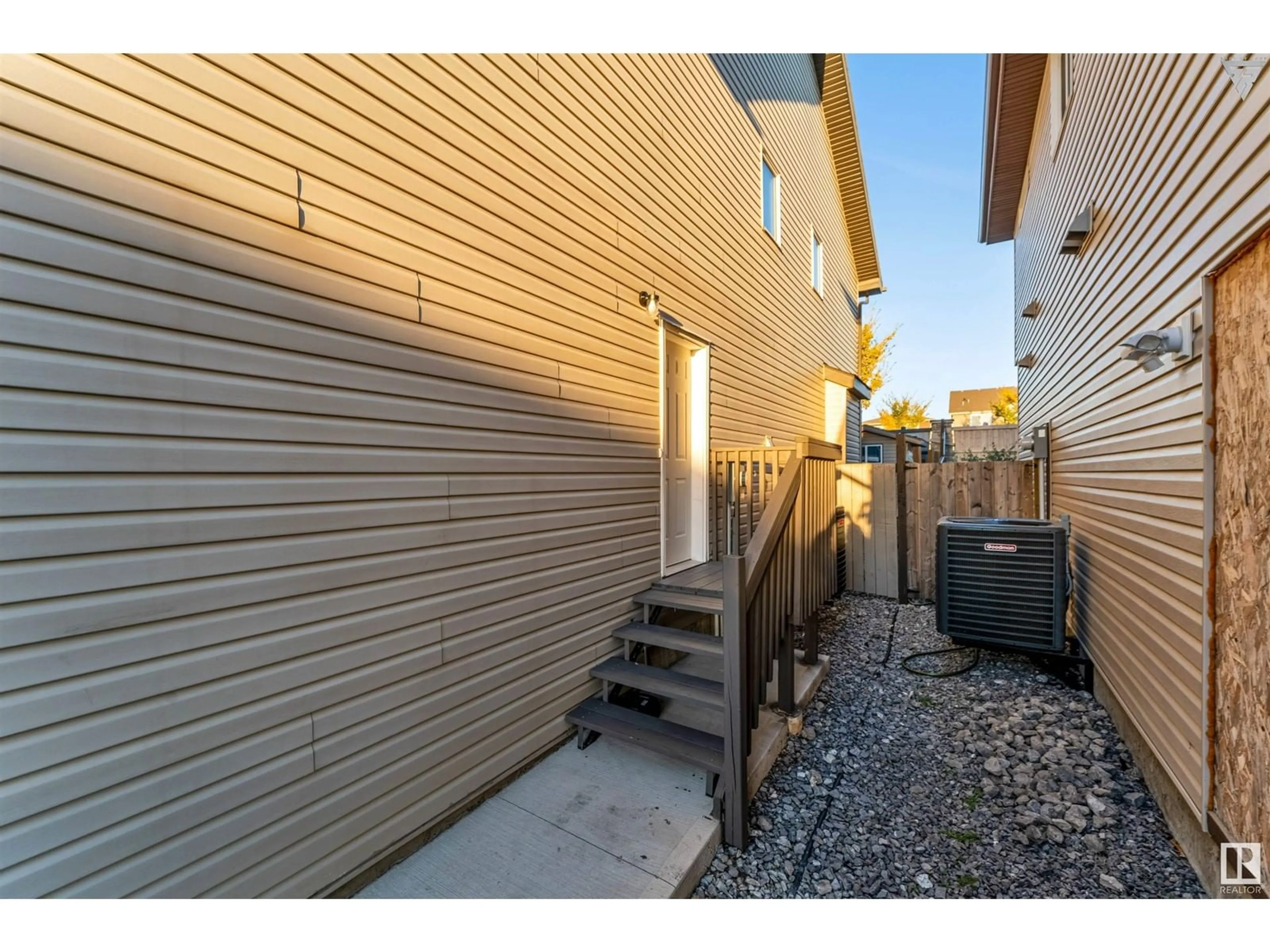 A pic from exterior of the house or condo, the fenced backyard for 1975 67 ST SW SW, Edmonton Alberta T6X0T4