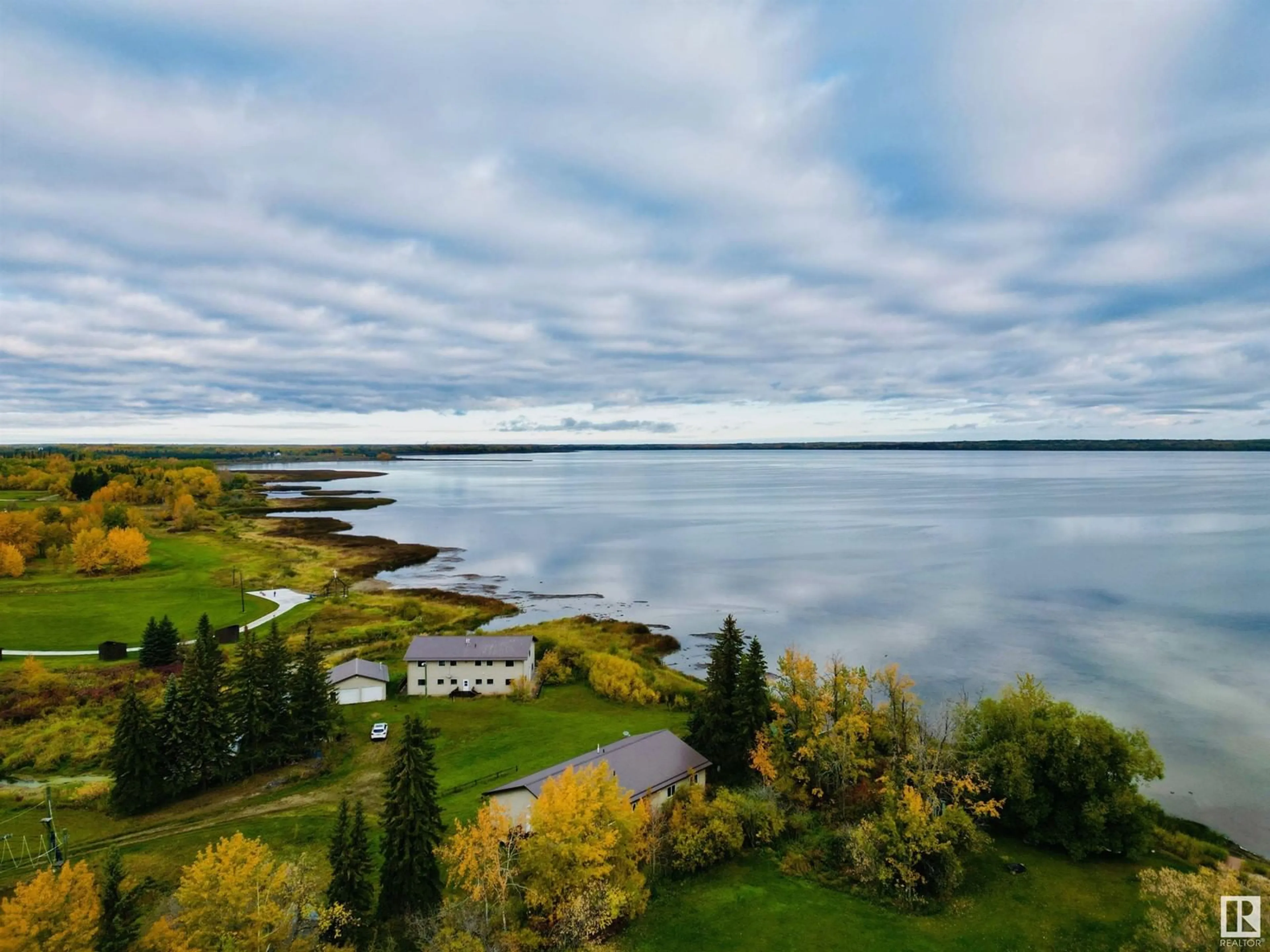 A pic from outside/outdoor area/front of a property/back of a property/a pic from drone, water/lake/river/ocean view for 220 - 3510 STE. ANNE, Rural Lac Ste. Anne County Alberta T0E0A0