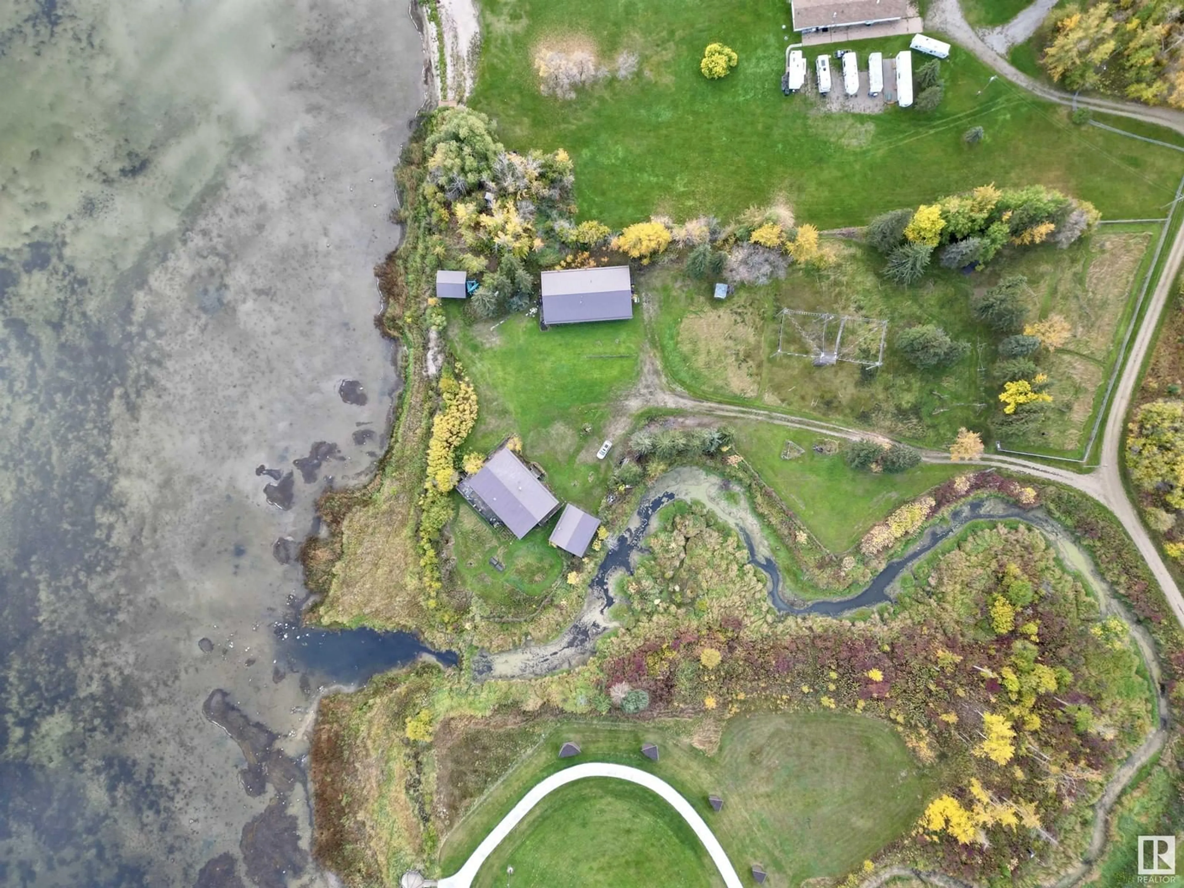 A pic from outside/outdoor area/front of a property/back of a property/a pic from drone, water/lake/river/ocean view for 220 - 3510 STE. ANNE, Rural Lac Ste. Anne County Alberta T0E0A0