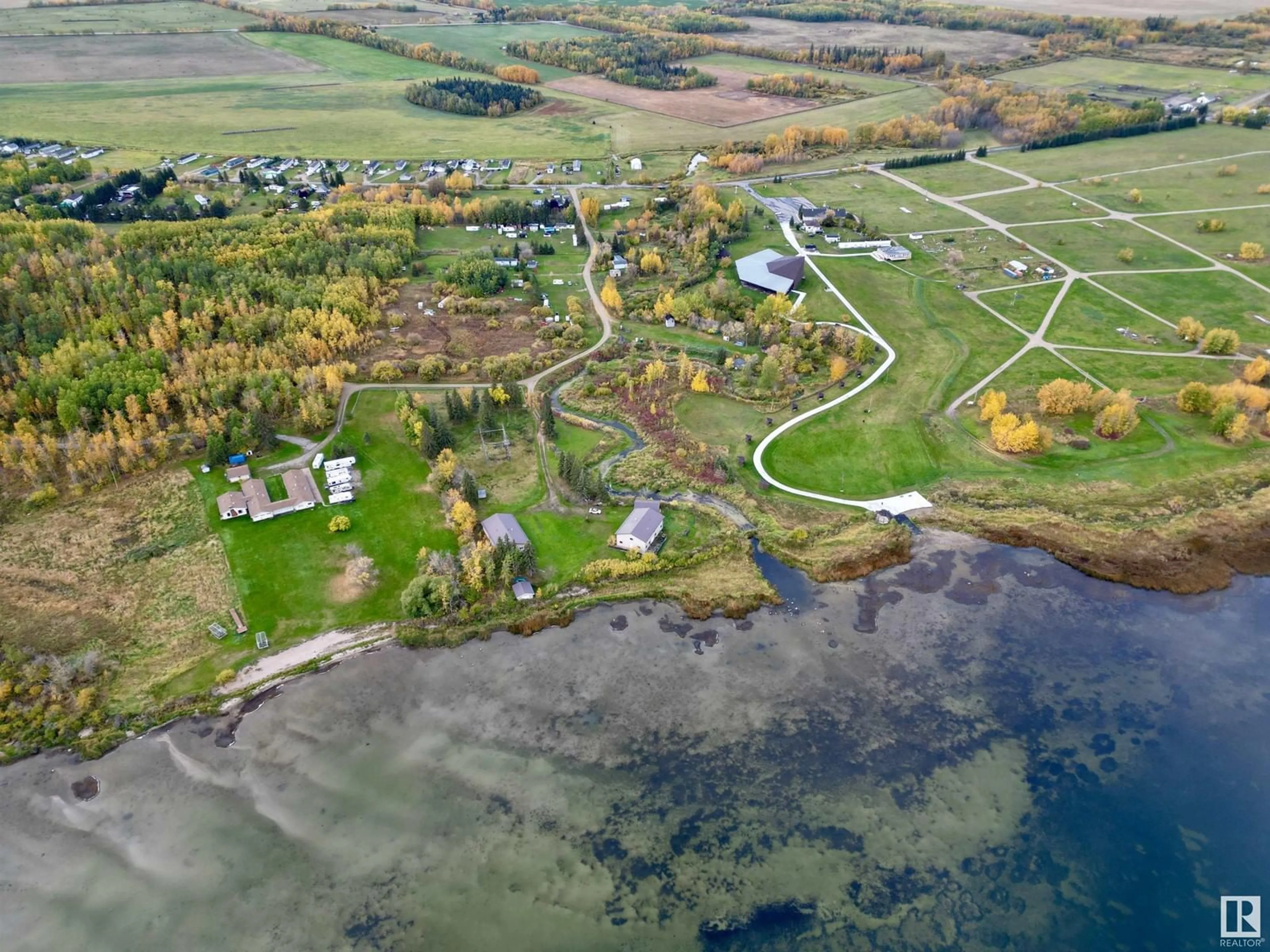 A pic from outside/outdoor area/front of a property/back of a property/a pic from drone, water/lake/river/ocean view for 220 - 3510 STE. ANNE, Rural Lac Ste. Anne County Alberta T0E0A0