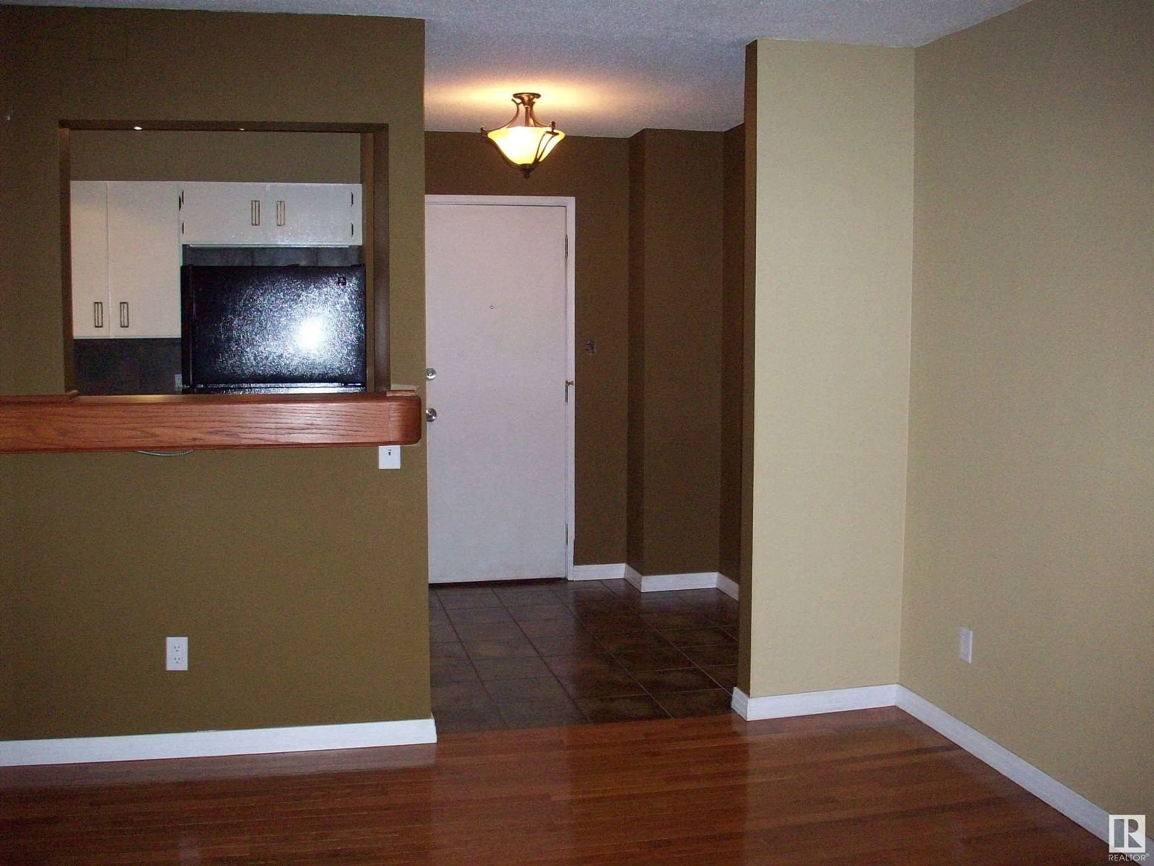 A pic of a room, wood floors for #12 11245 109 AV NW, Edmonton Alberta T5H4B1