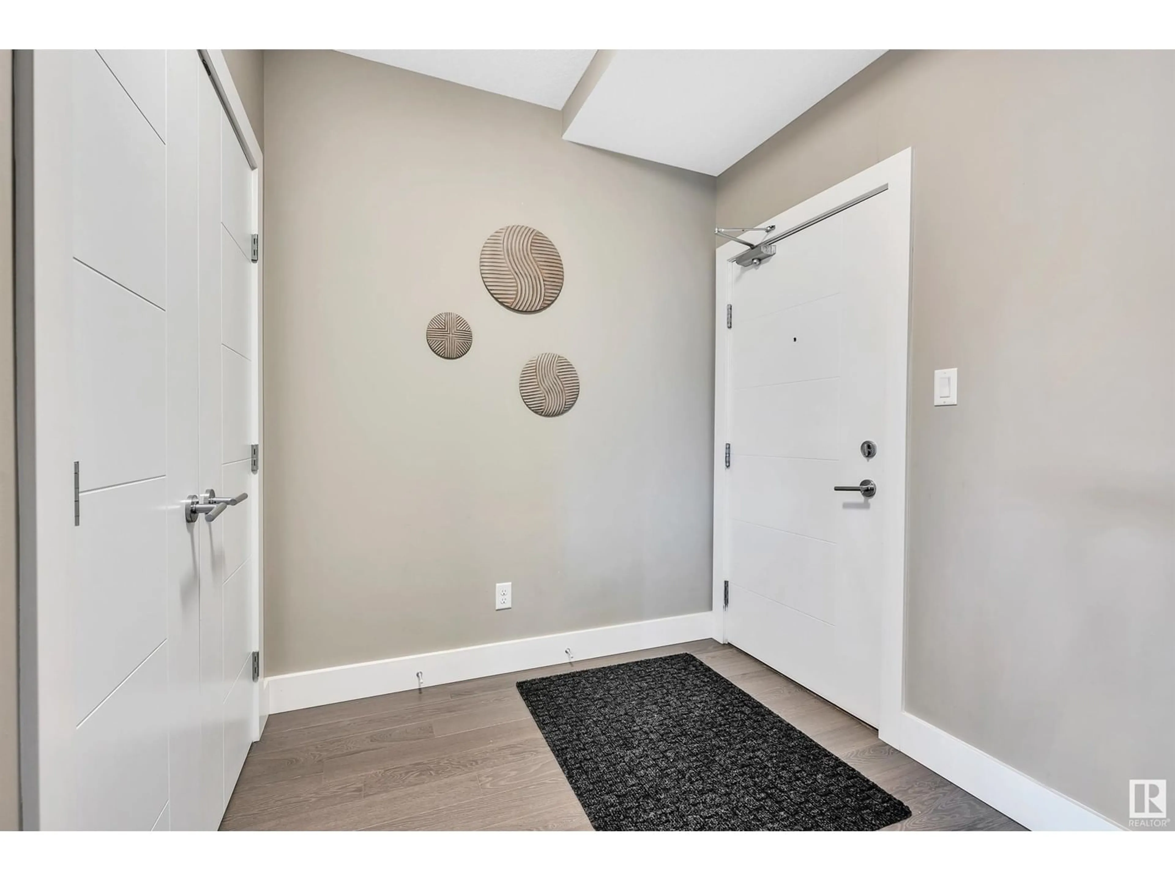 Indoor entryway, wood floors for #102 11080 Ellerslie RD SW, Edmonton Alberta T6W2C2