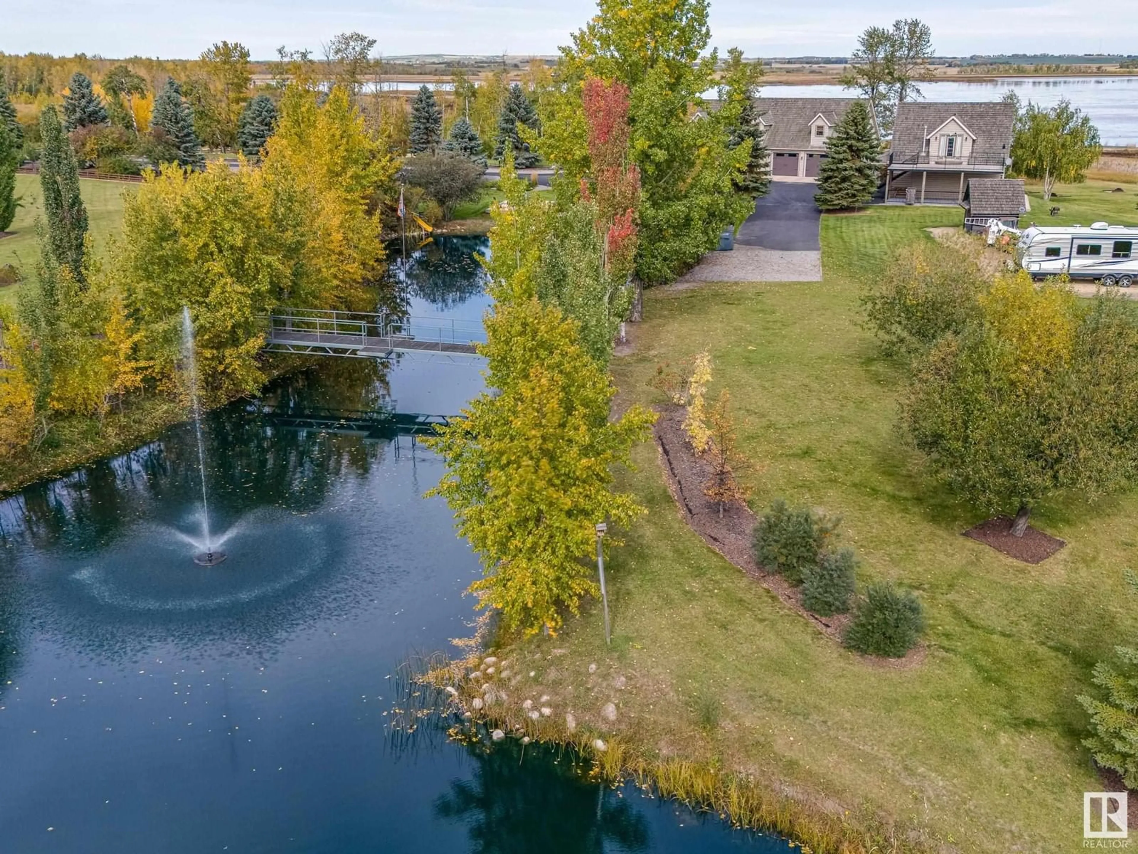 A pic from outside/outdoor area/front of a property/back of a property/a pic from drone, water/lake/river/ocean view for 40303 RANGE ROAD 222, Rural Lacombe County Alberta T0B3C0