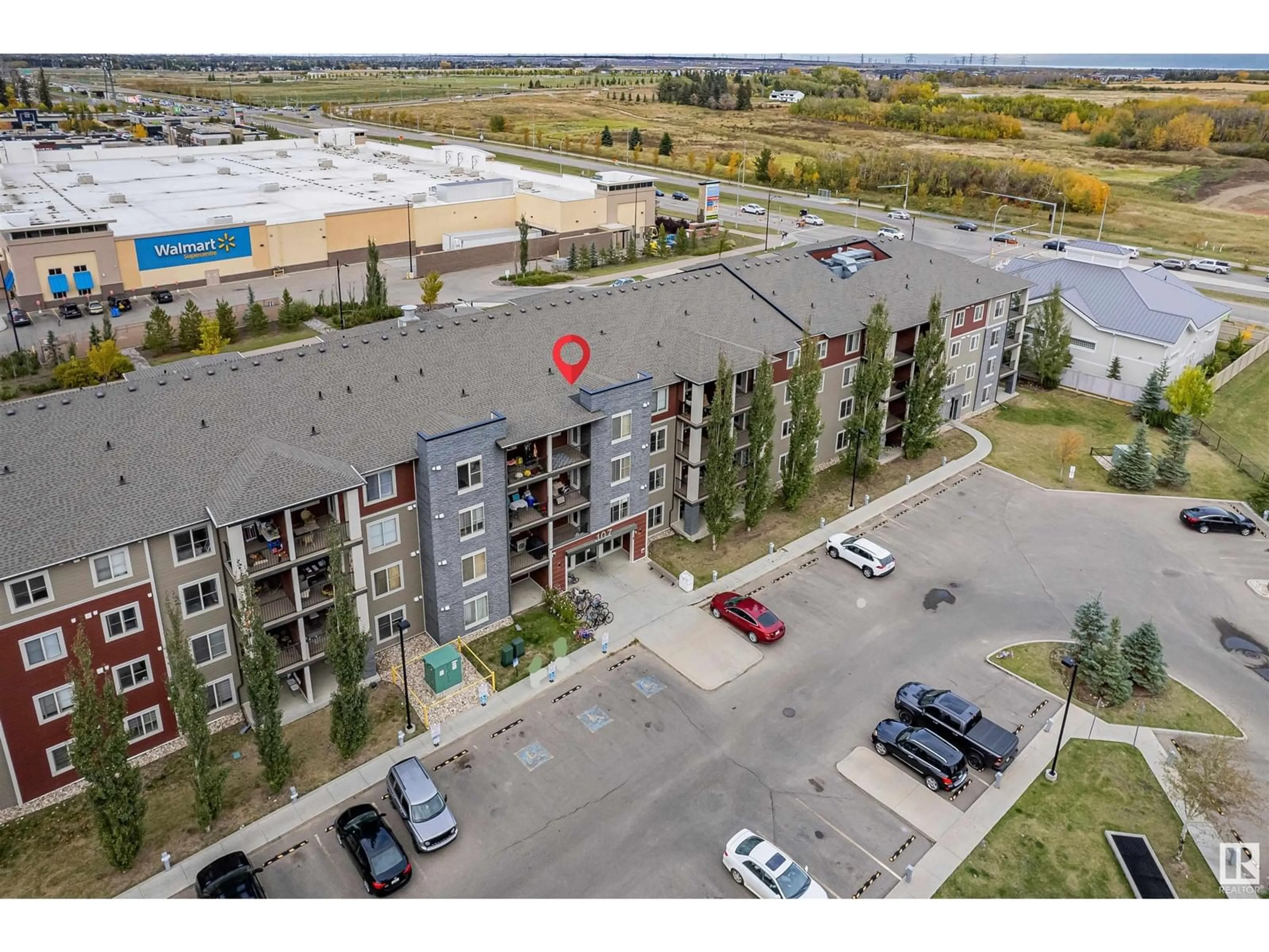 A pic from exterior of the house or condo, the front or back of building for #208 107 WATT CM SW, Edmonton Alberta T6X2C6