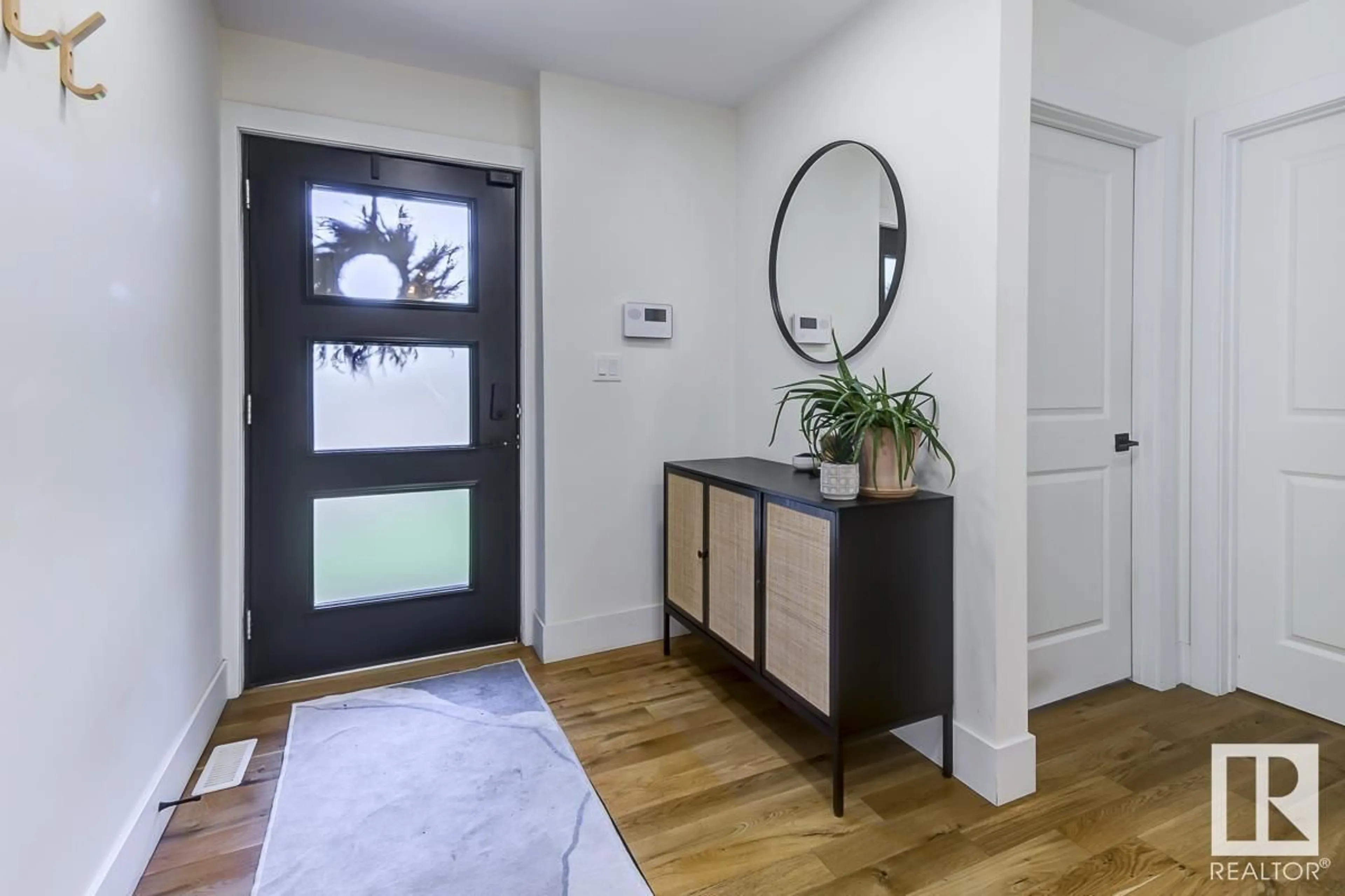 Indoor entryway, wood floors for 10444 131 ST NW, Edmonton Alberta T5N1Y3