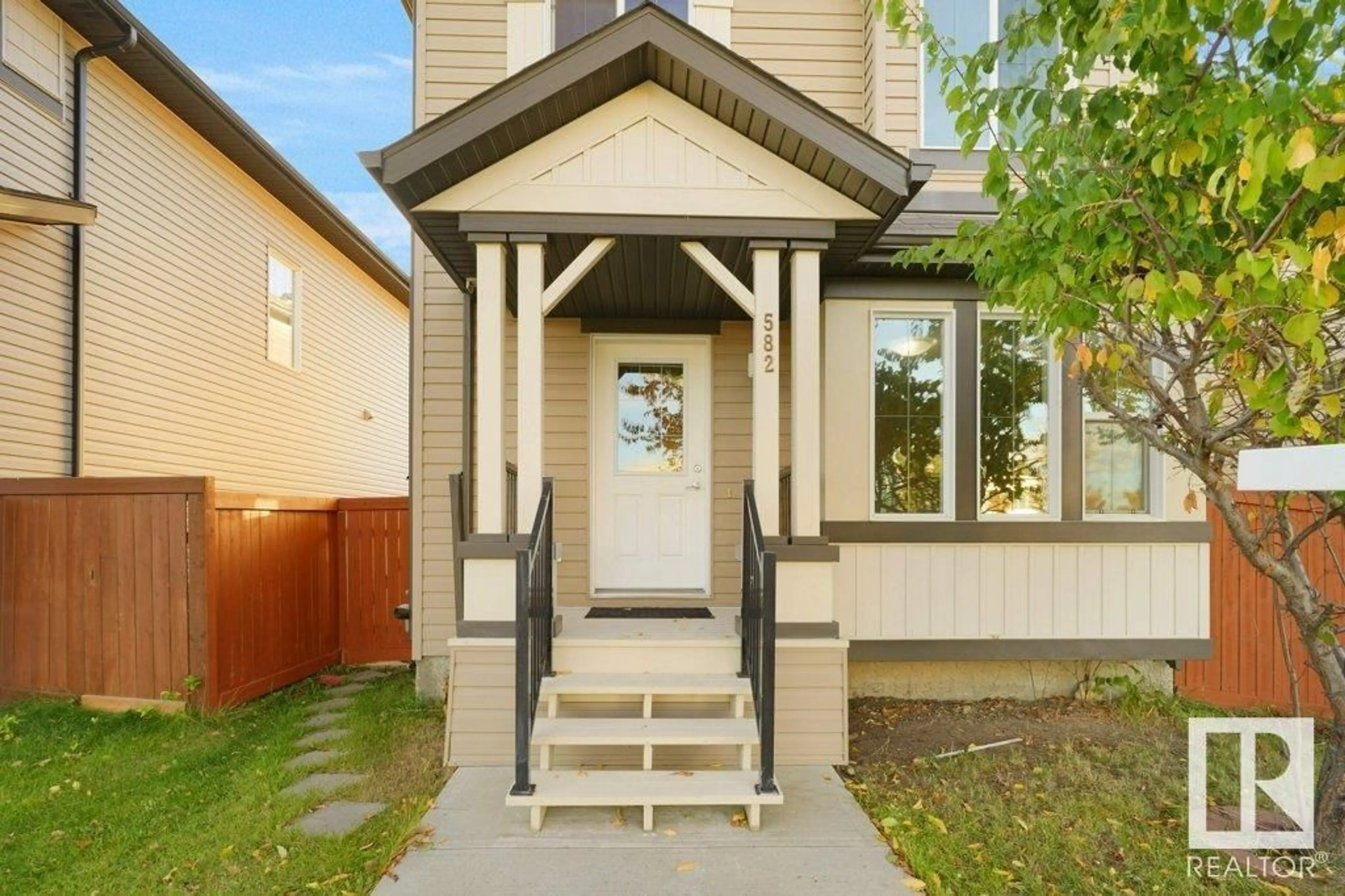 Frontside or backside of a home, the fenced backyard for 582 TAMARACK RD NW, Edmonton Alberta T6T0M8