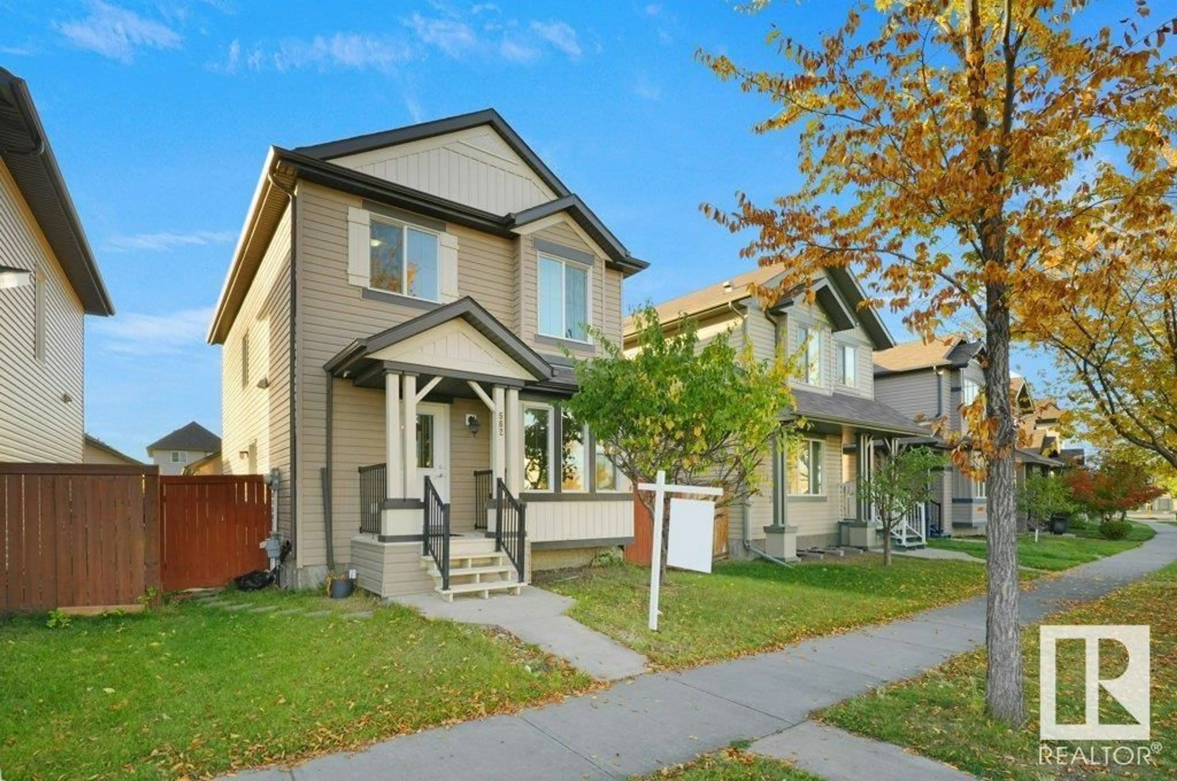 Frontside or backside of a home, the fenced backyard for 582 TAMARACK RD NW, Edmonton Alberta T6T0M8