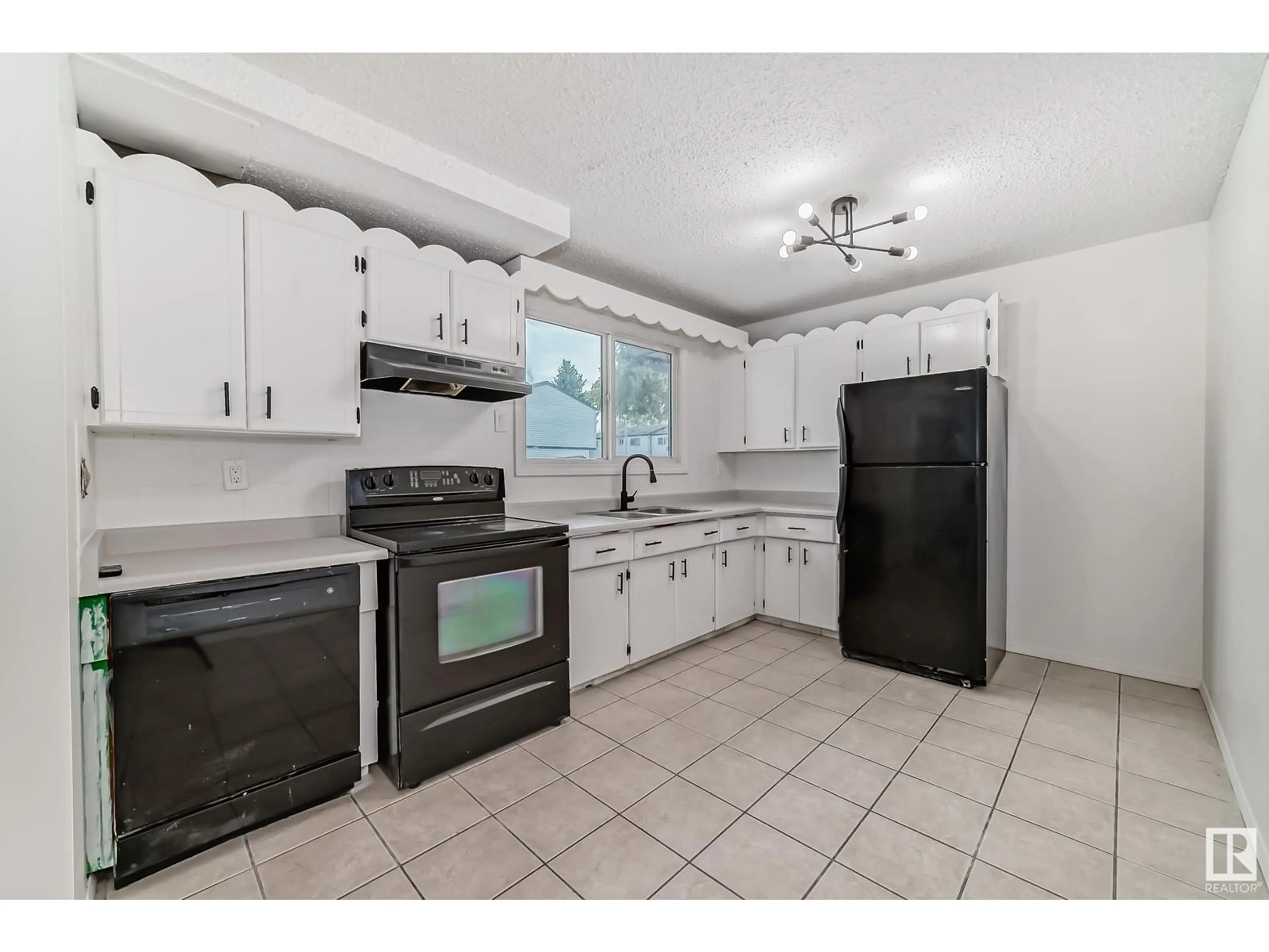 Standard kitchen, wood floors, cottage for 2645 135 AV NW, Edmonton Alberta T5A3S3