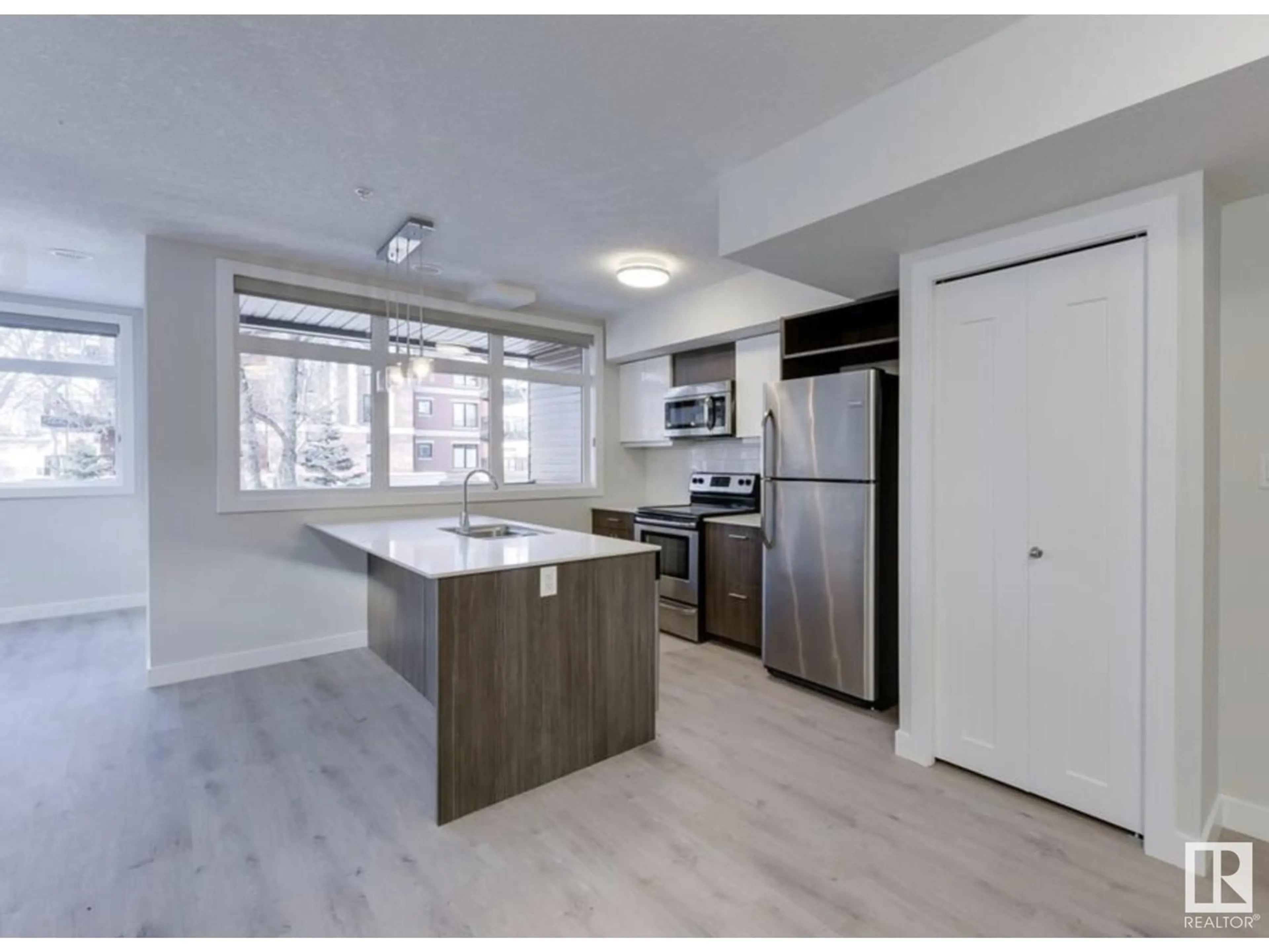 Open concept kitchen for #201 10227 115 ST NW, Edmonton Alberta T5K1K7