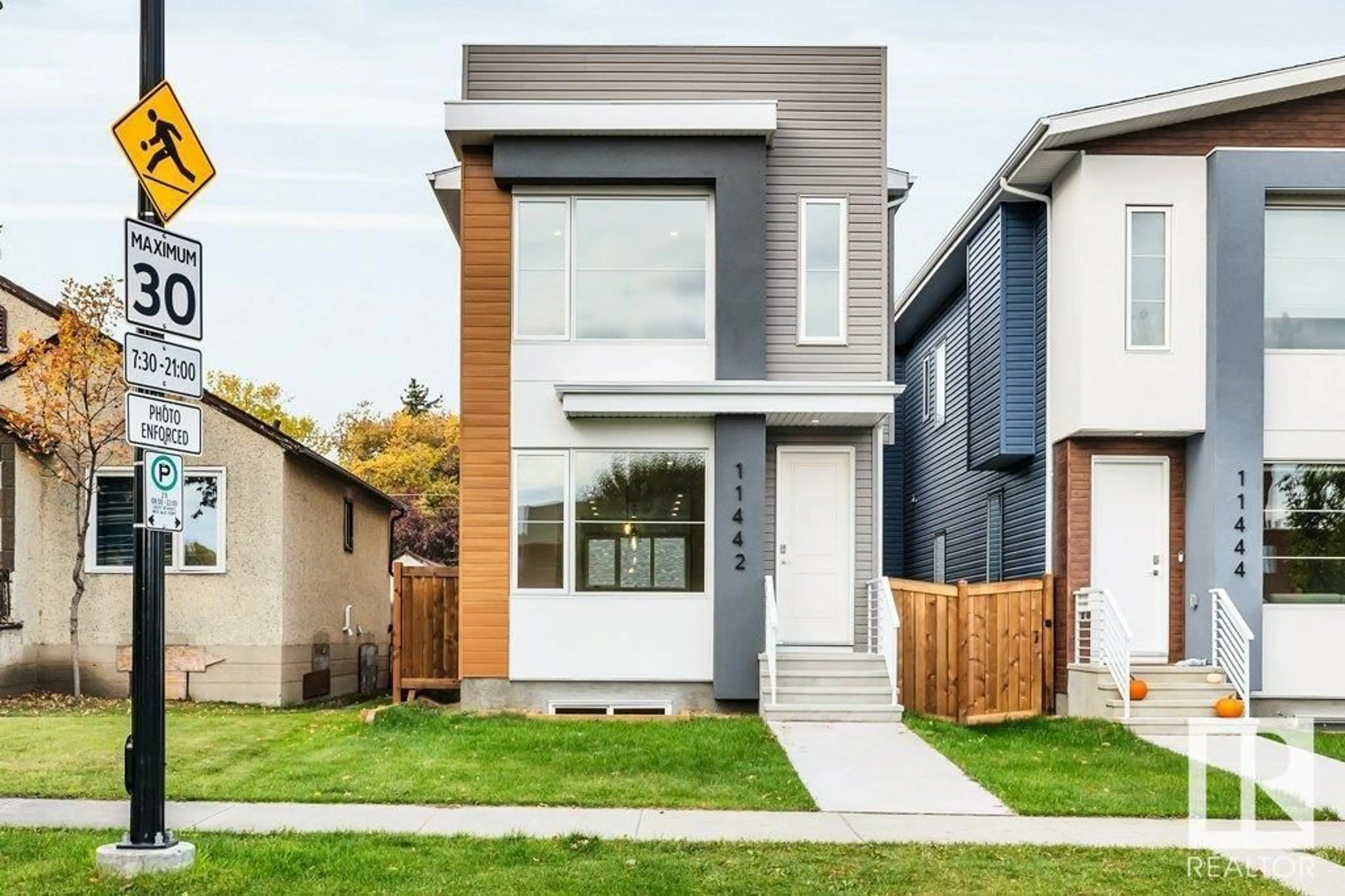 Frontside or backside of a home, the fenced backyard for 11442 70 ST NW, Edmonton Alberta T5B1T4