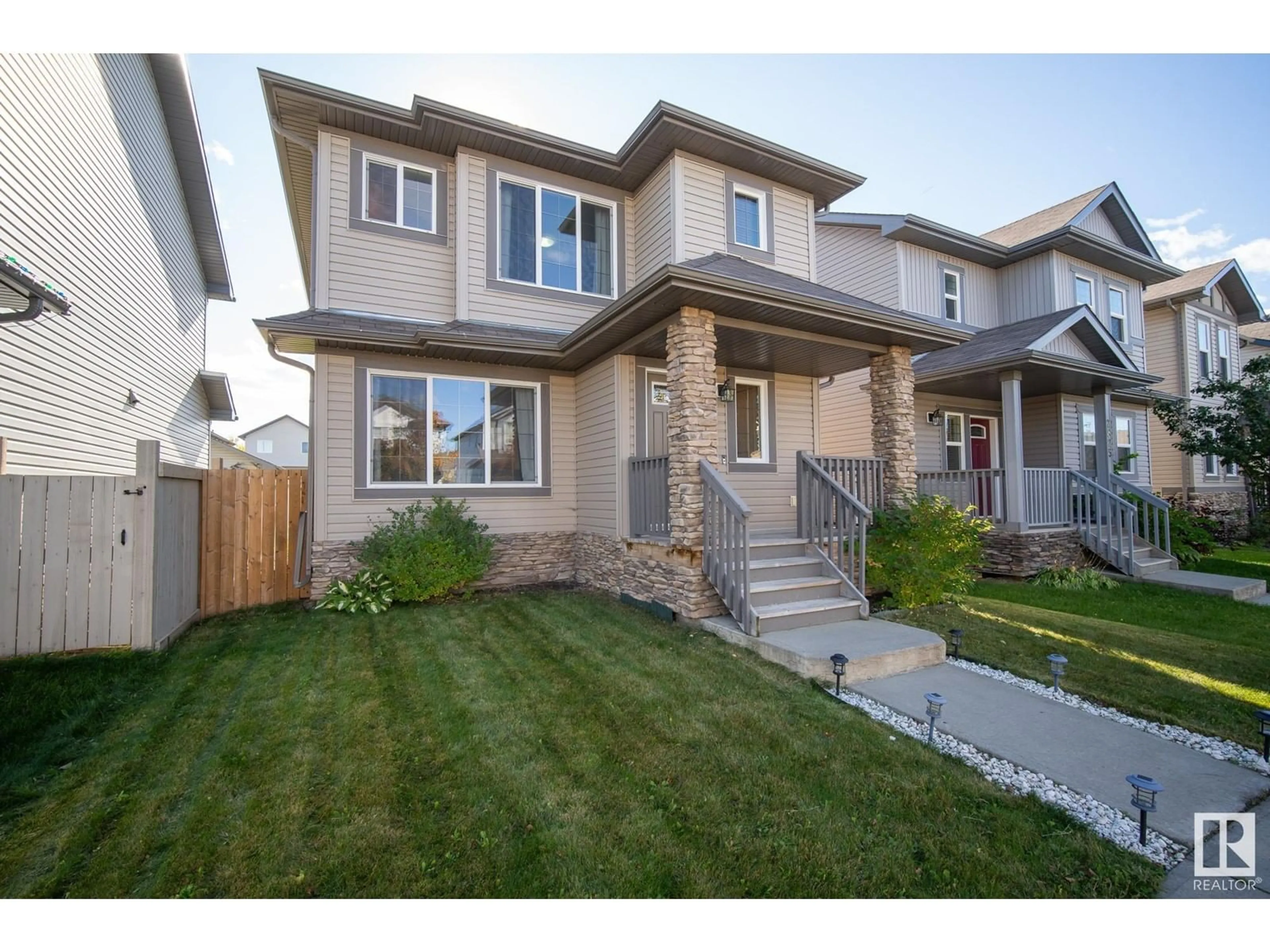 Frontside or backside of a home, the fenced backyard for 2821 21A AV NW, Edmonton Alberta T6T0K2