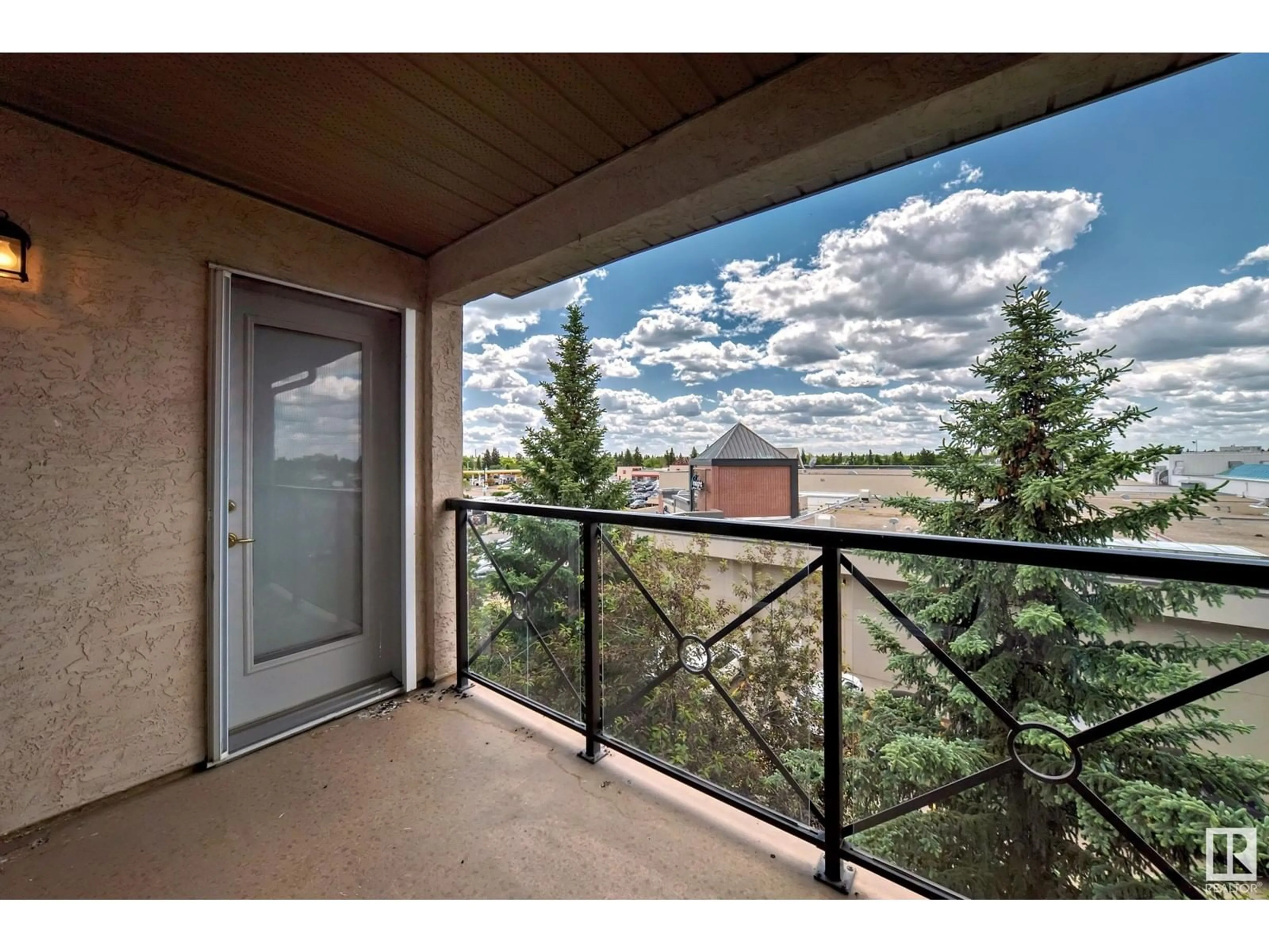 A pic from exterior of the house or condo, the fenced backyard for #412 8912 156 ST NW, Edmonton Alberta T5R5Z2