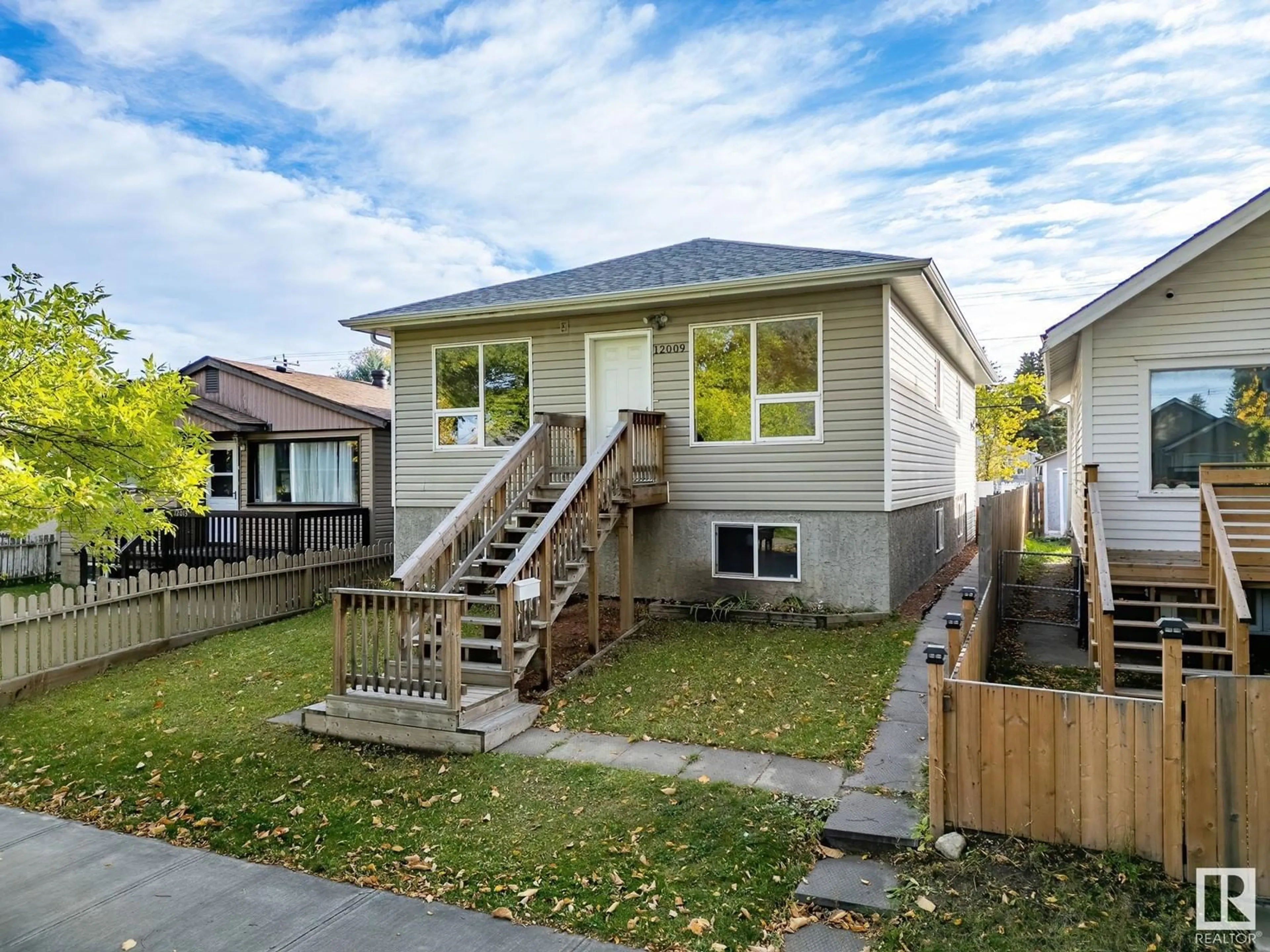 Frontside or backside of a home, the fenced backyard for 12009 67 ST NW, Edmonton Alberta T5B1M4