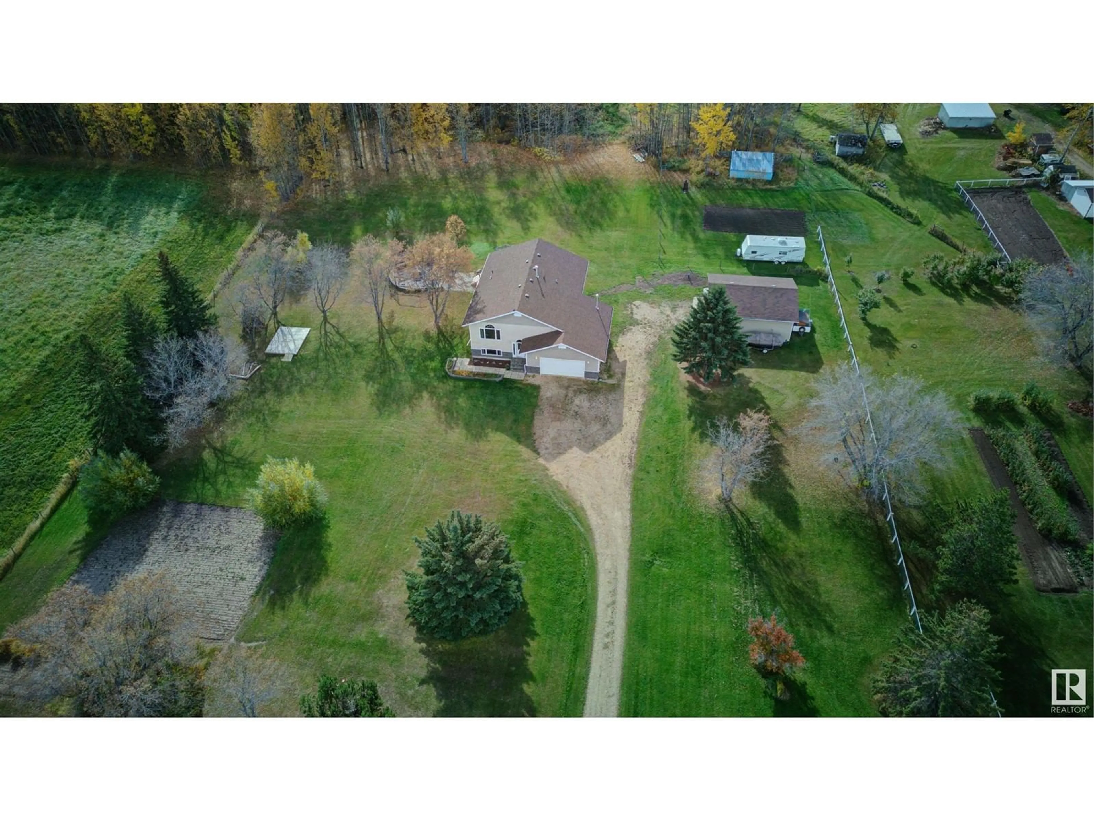 A pic from outside/outdoor area/front of a property/back of a property/a pic from drone, unknown for 5113 TWP RD 592A, Rural Barrhead County Alberta T7N1N3