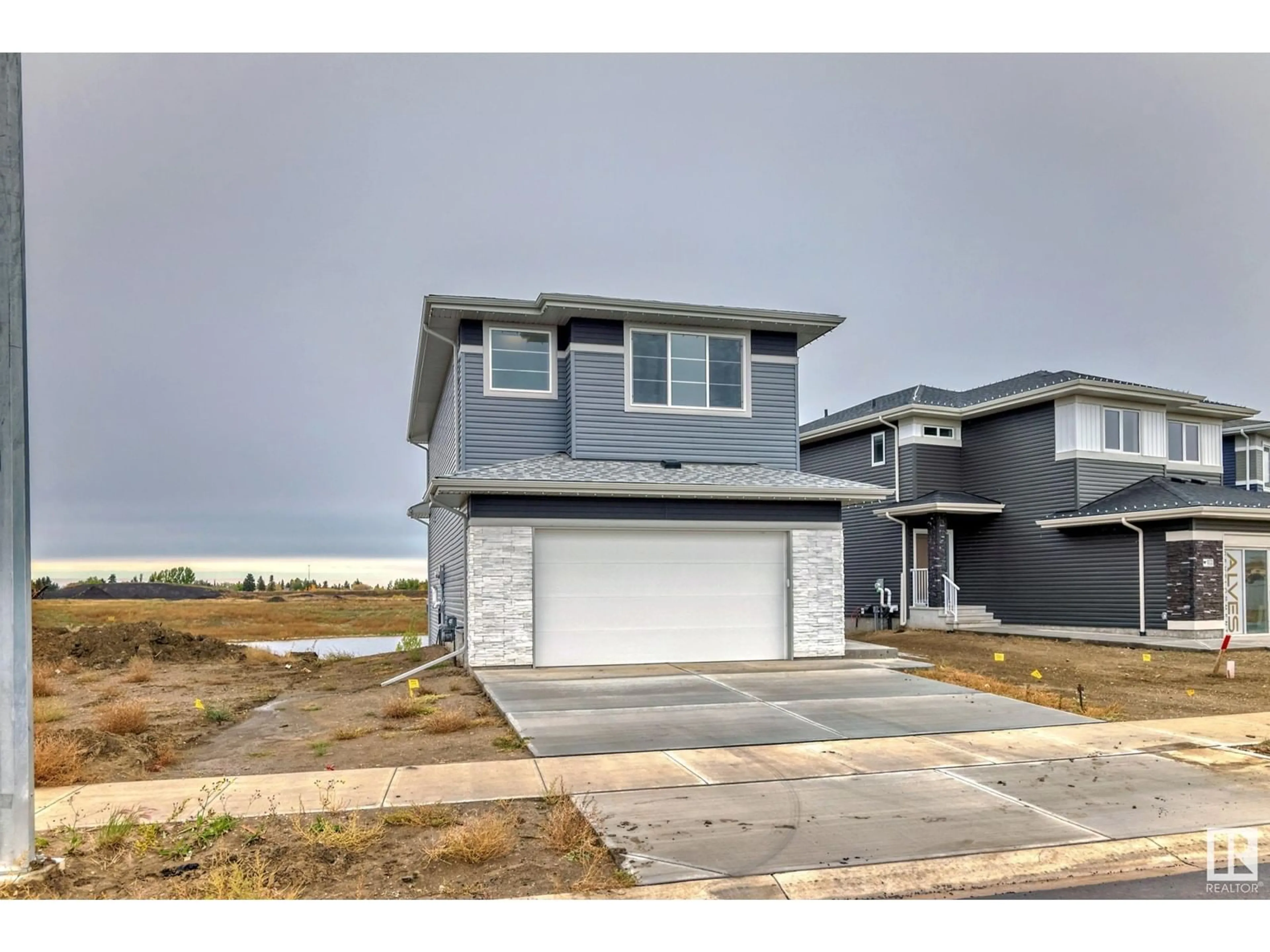 Frontside or backside of a home, the street view for 10238 92A AV, Morinville Alberta T8R2R4