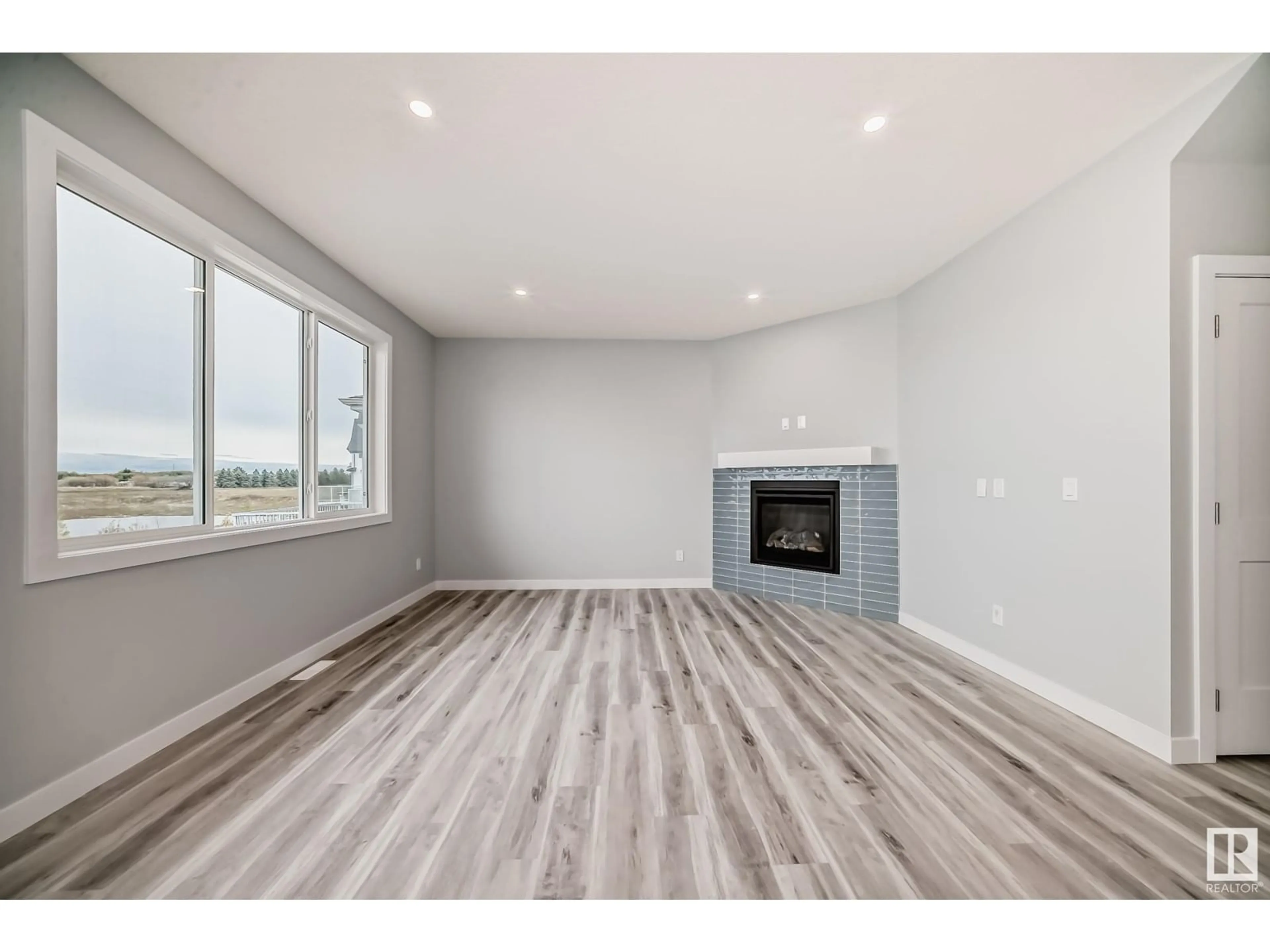 A pic of a room, wood floors for 10238 92A AV, Morinville Alberta T8R2R4