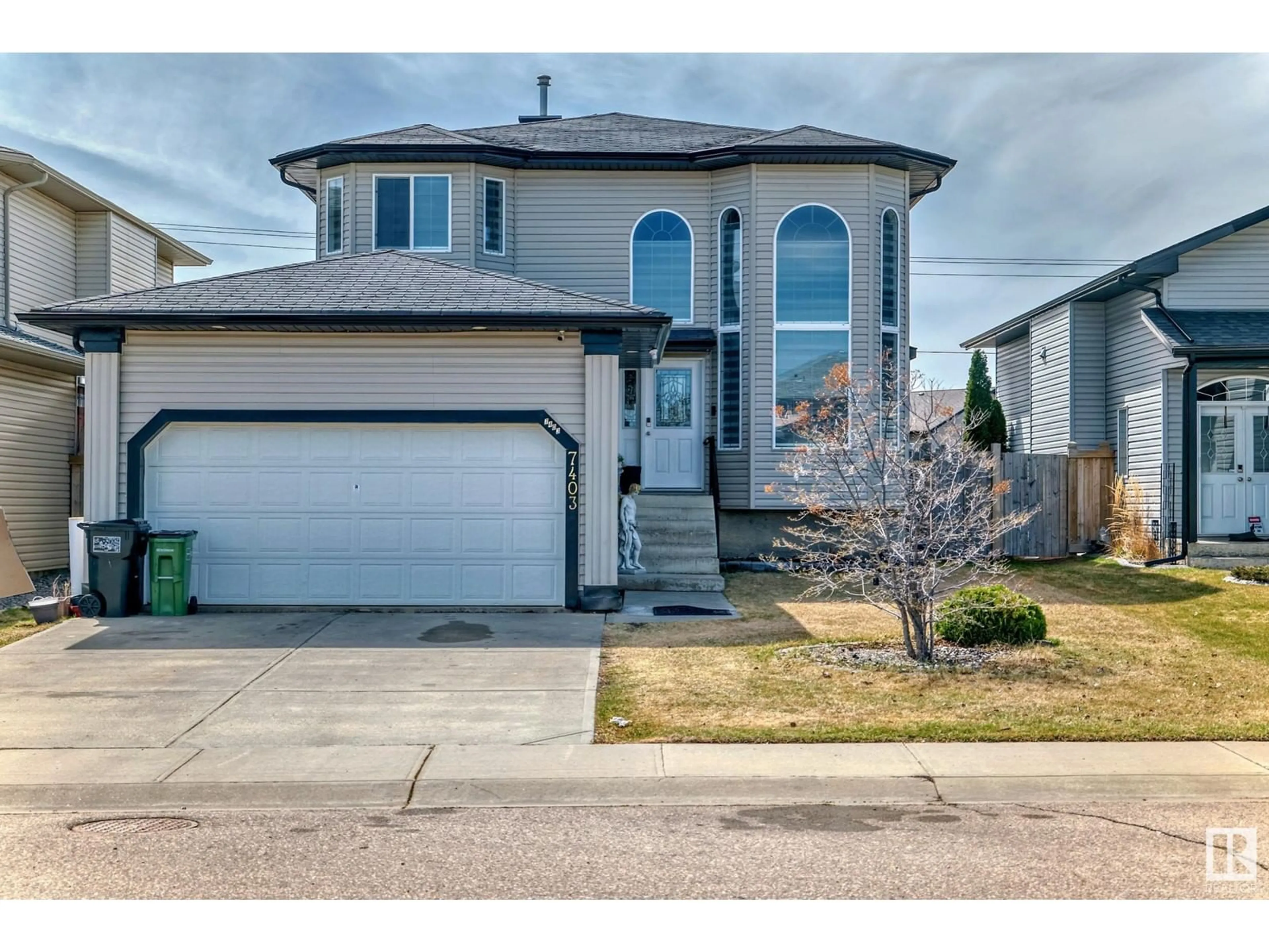 Frontside or backside of a home, the street view for 7403 168 AV NW, Edmonton Alberta T5Z0A3