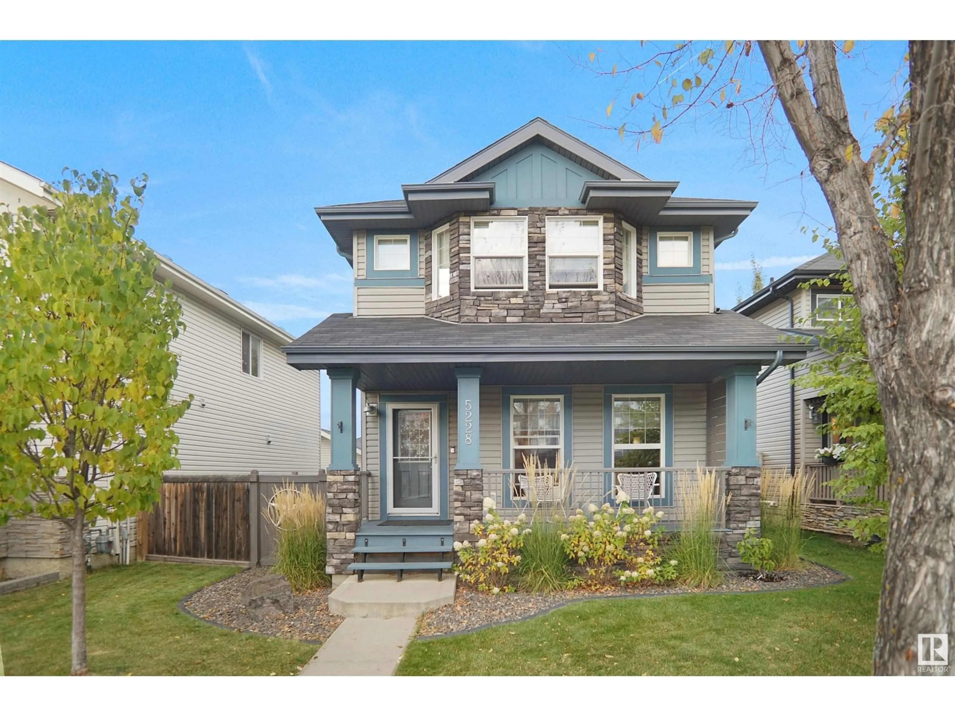 Frontside or backside of a home, the fenced backyard for 5228 4 AV SW, Edmonton Alberta T6X0L4