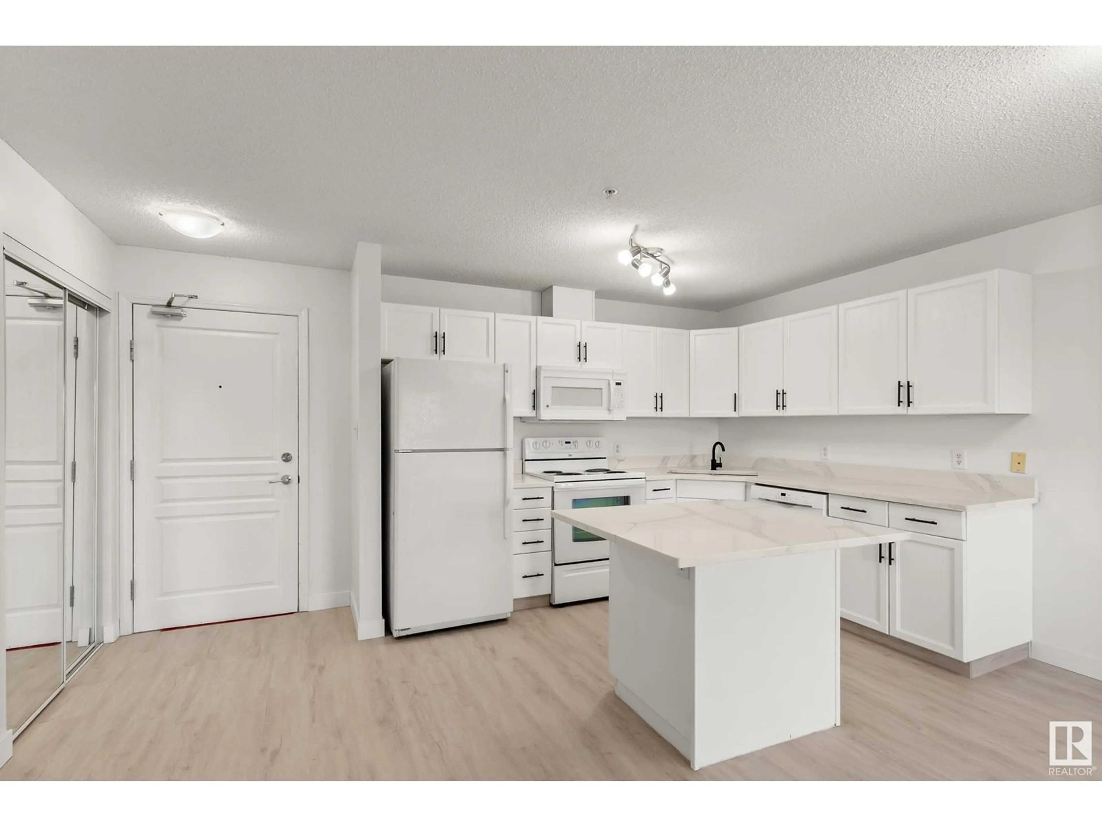 Open concept kitchen for #320 309 CLAREVIEW STATION DR NW, Edmonton Alberta T5Y0C5