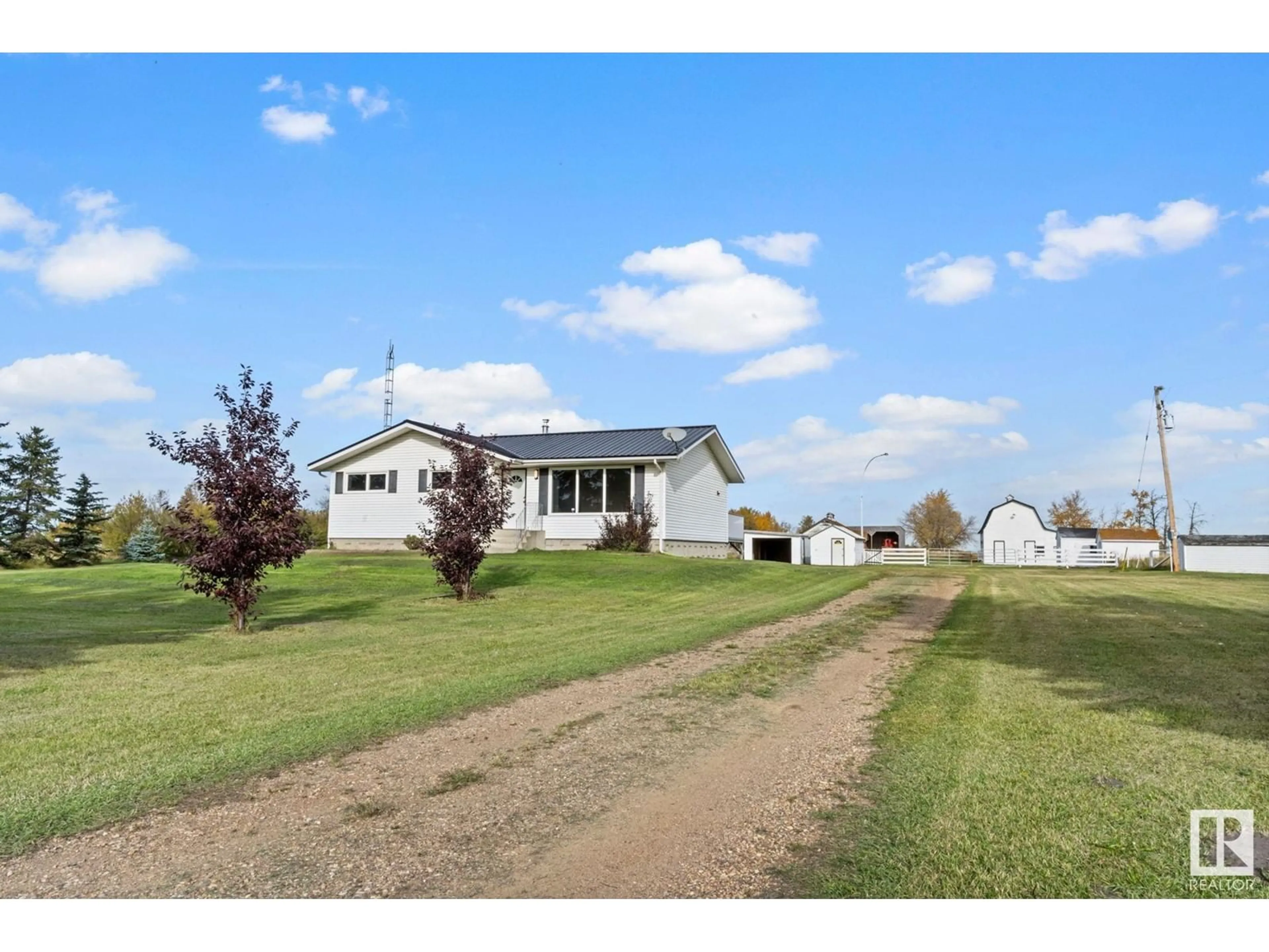 Frontside or backside of a home, the fenced backyard for 153080 TWP RD 565, Rural Two Hills County Alberta T0B4R0