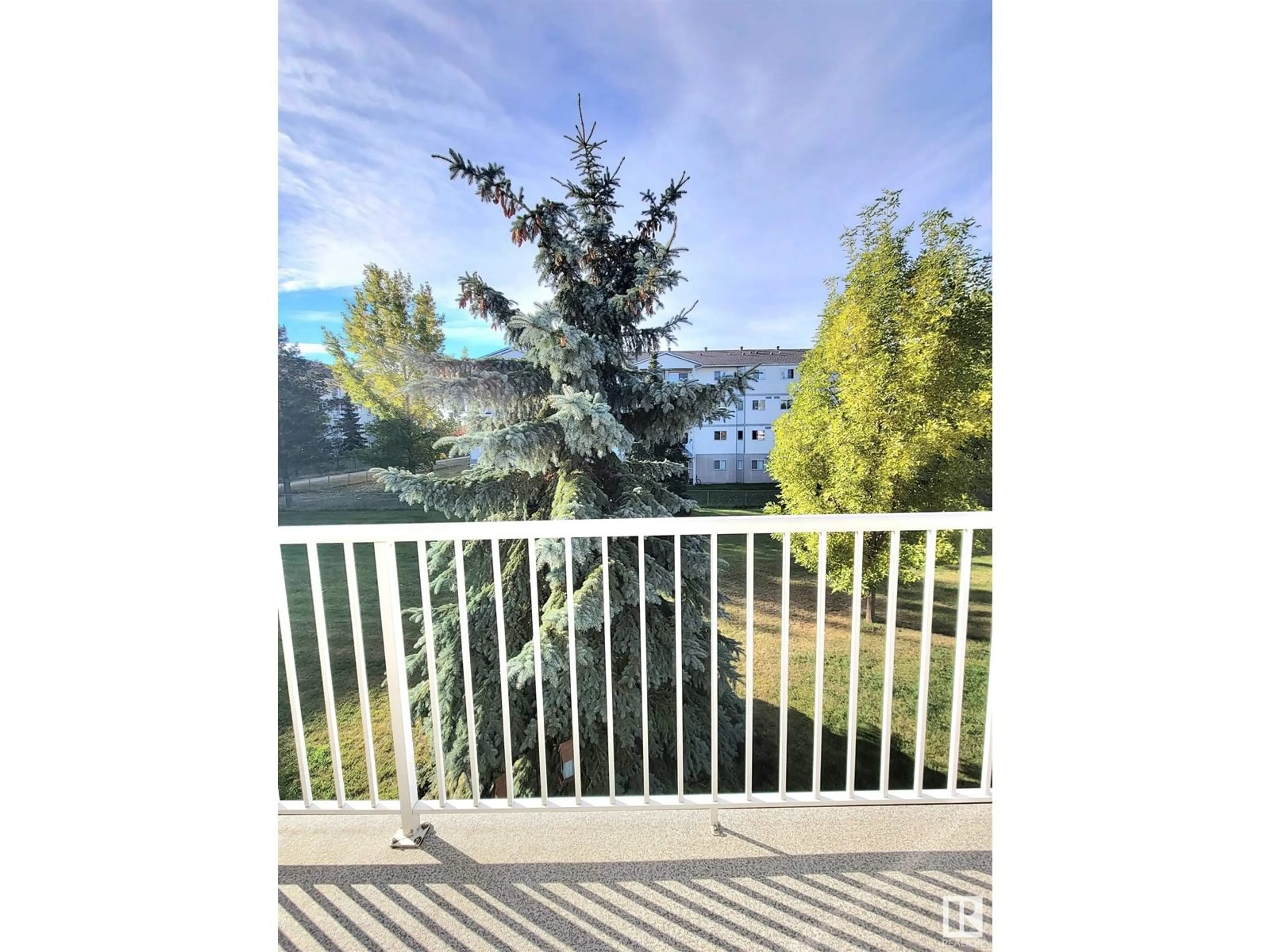 Balcony in the apartment, the fenced backyard for #108D 122 WESTPARK, Fort Saskatchewan Alberta T8L4M2