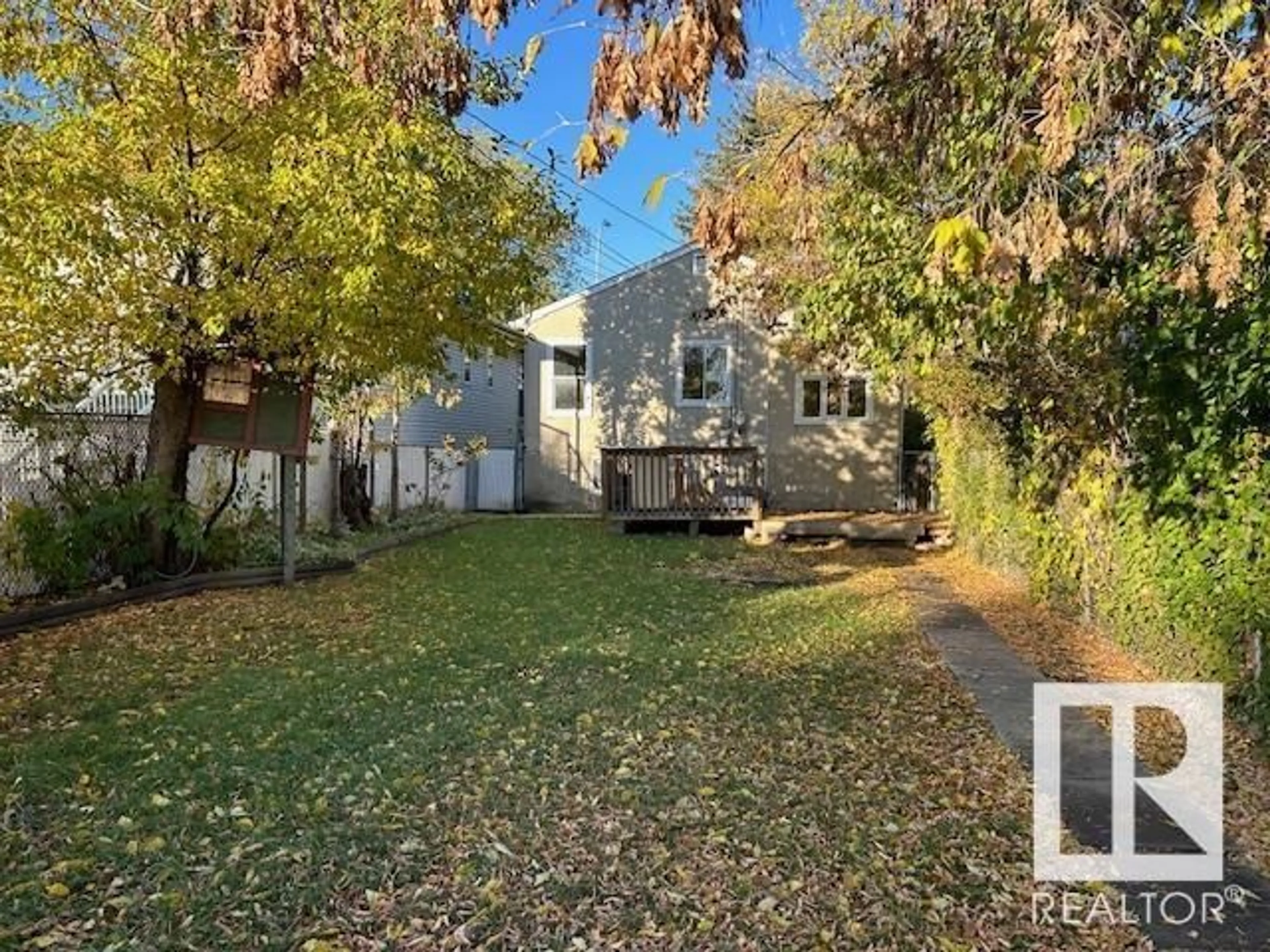 Frontside or backside of a home, the fenced backyard for 10341 149 ST NW, Edmonton Alberta T5P1L4