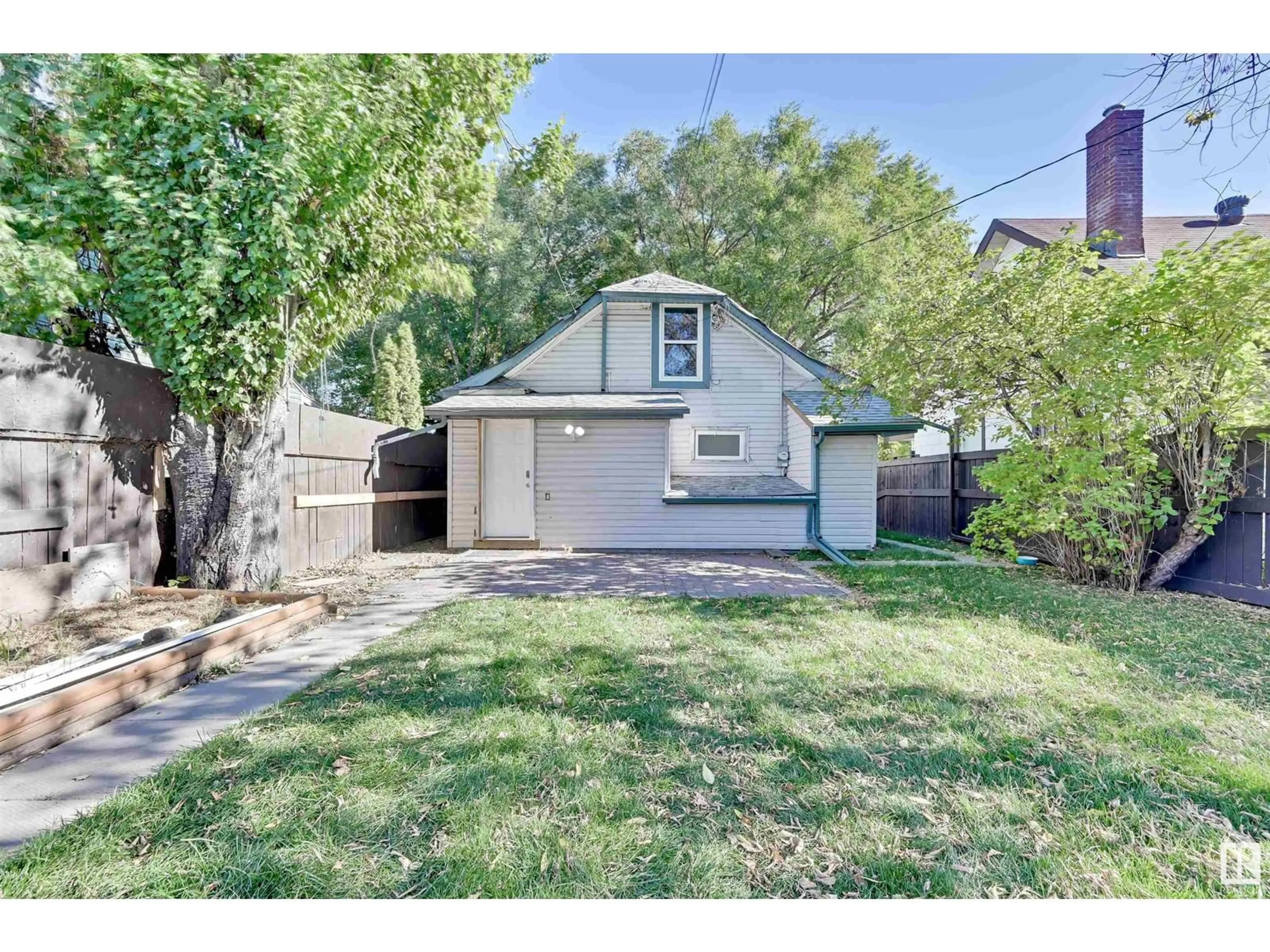 Frontside or backside of a home, the fenced backyard for 11712 84 ST NW NW, Edmonton Alberta T5B3C3