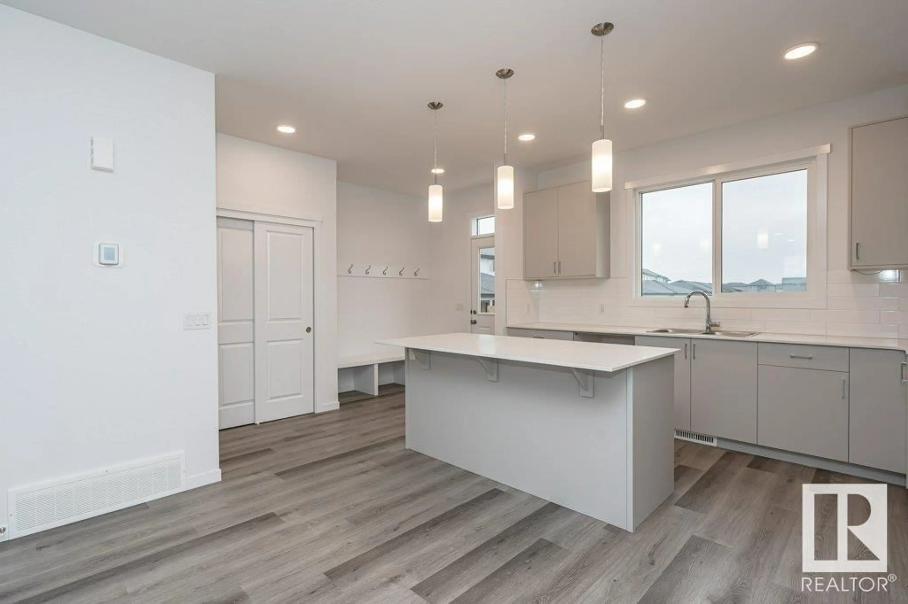 Open concept kitchen for 2431 TRUMPETER WY NW, Edmonton Alberta T5S0S9