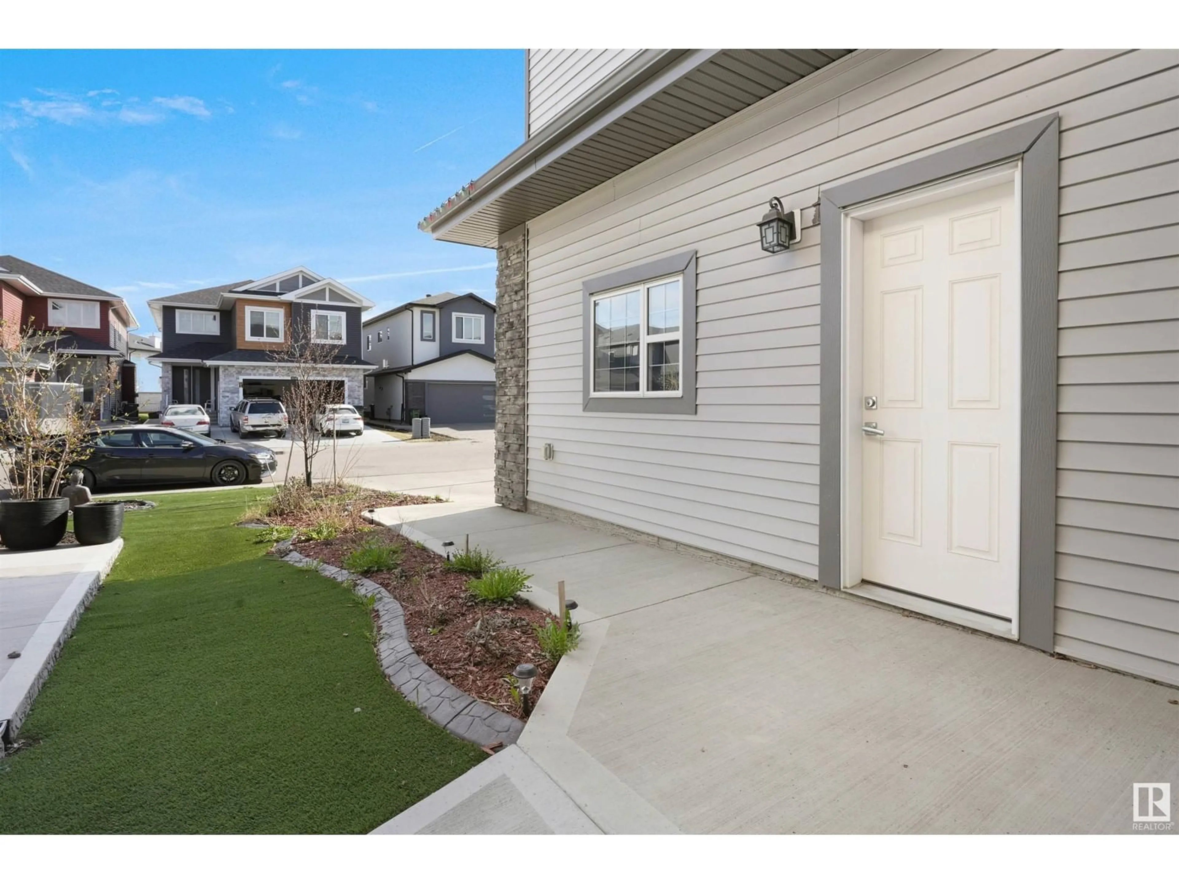 Frontside or backside of a home, the fenced backyard for 1540 151 AV NW, Edmonton Alberta T5Y3T4