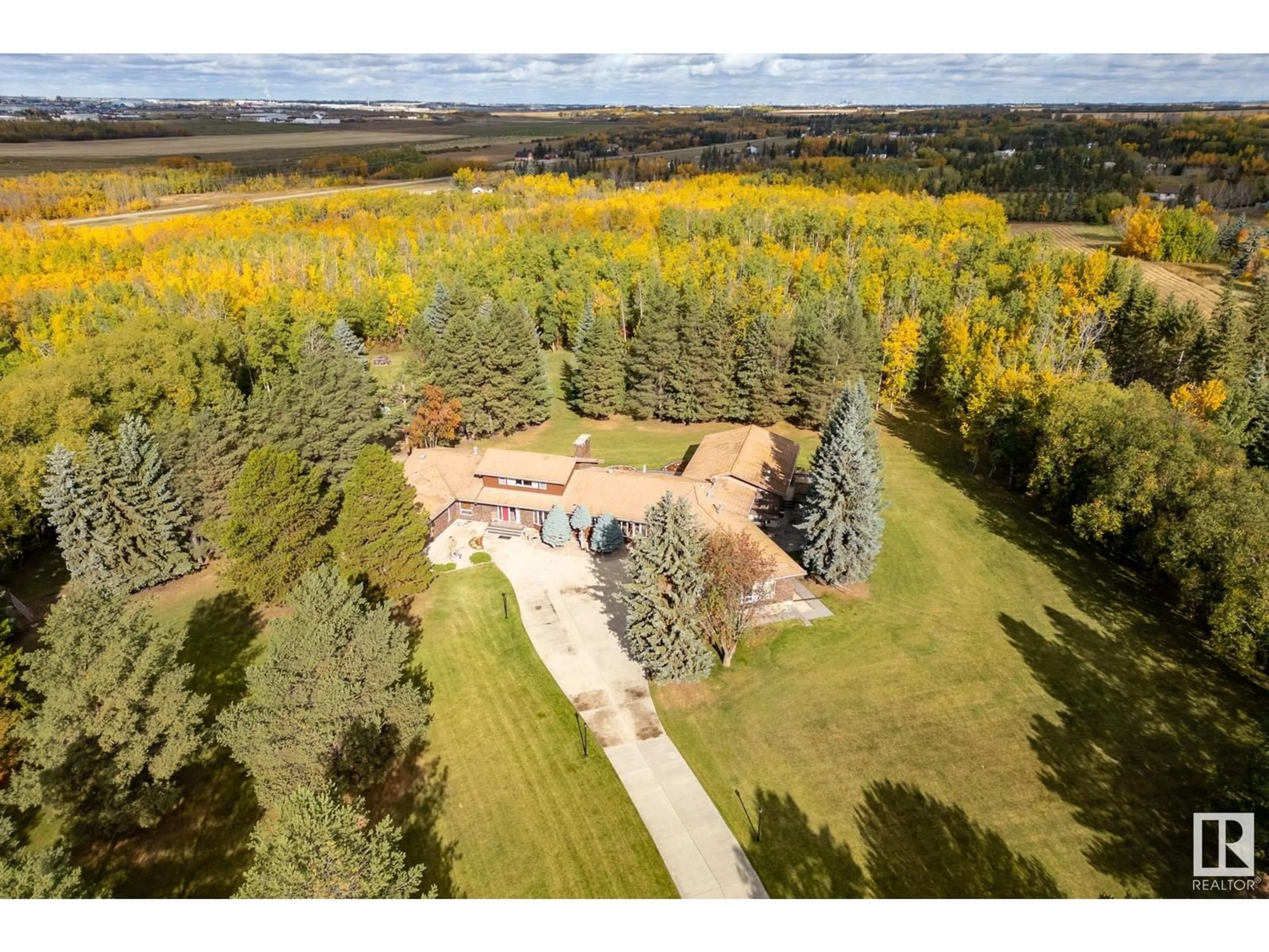 A pic from exterior of the house or condo, the fenced backyard for #1040 50242 RGE ROAD 244 A, Rural Leduc County Alberta T4X0P4