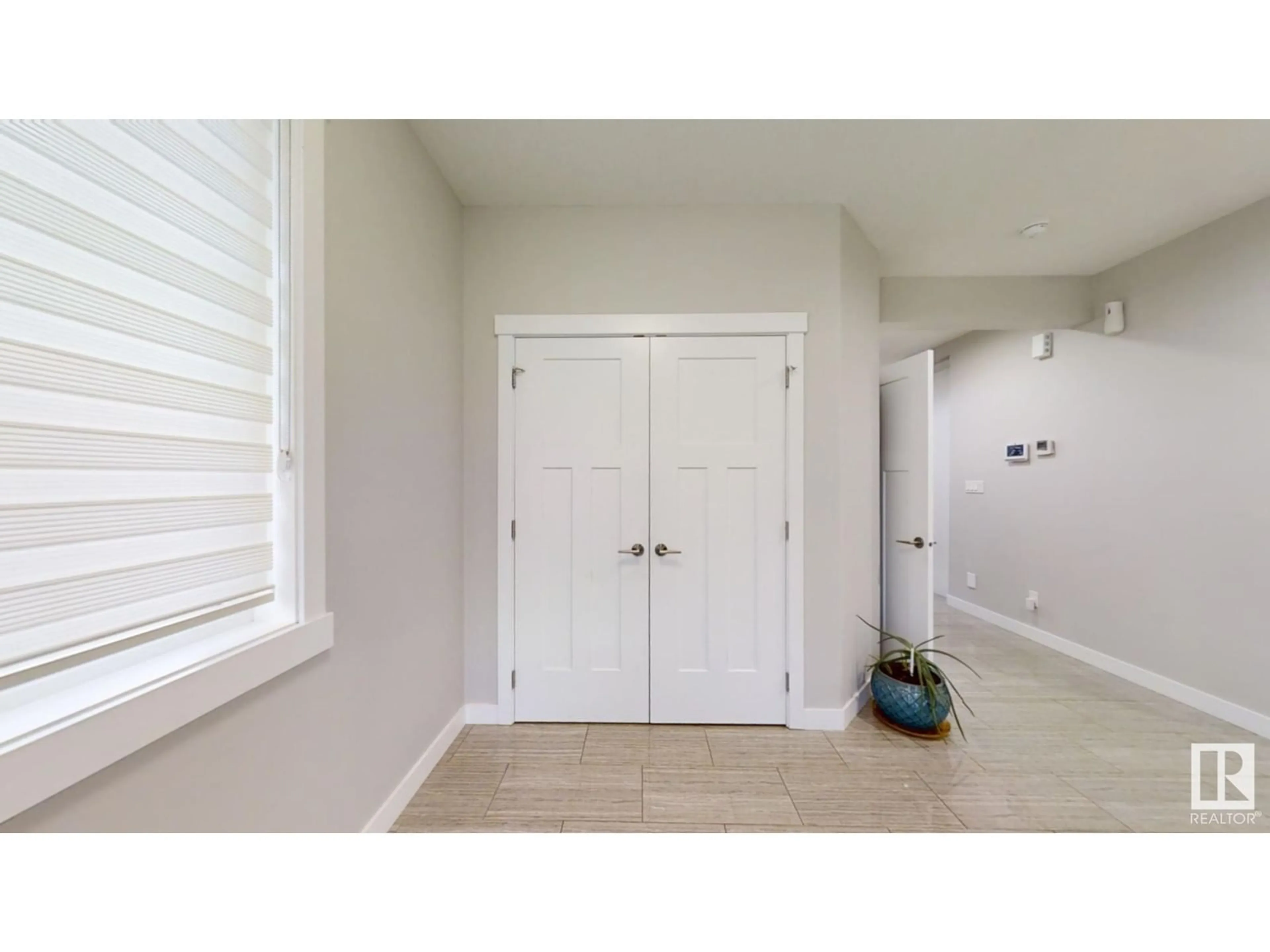 Indoor entryway, wood floors for 3803 AGAR GREEN GR SW, Edmonton Alberta T6W0W8