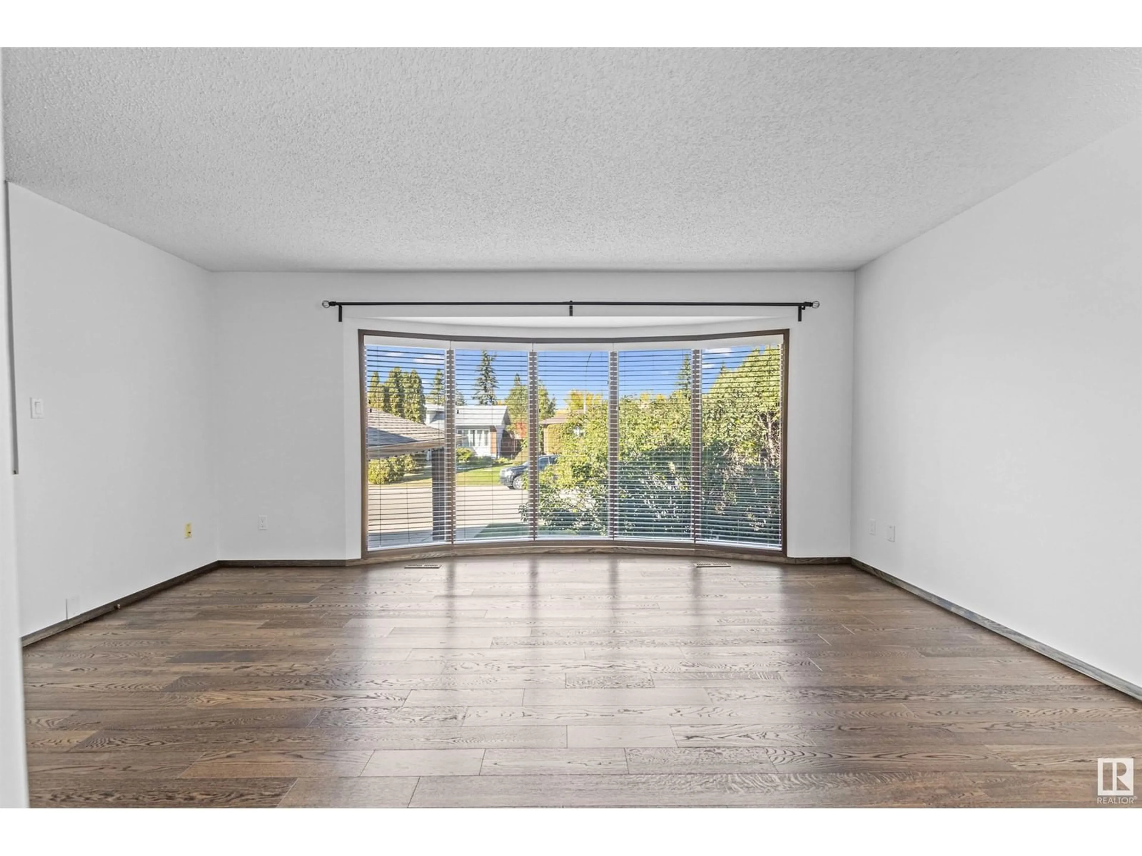 A pic of a room, wood floors for 2111 104B ST NW, Edmonton Alberta T6R1V9