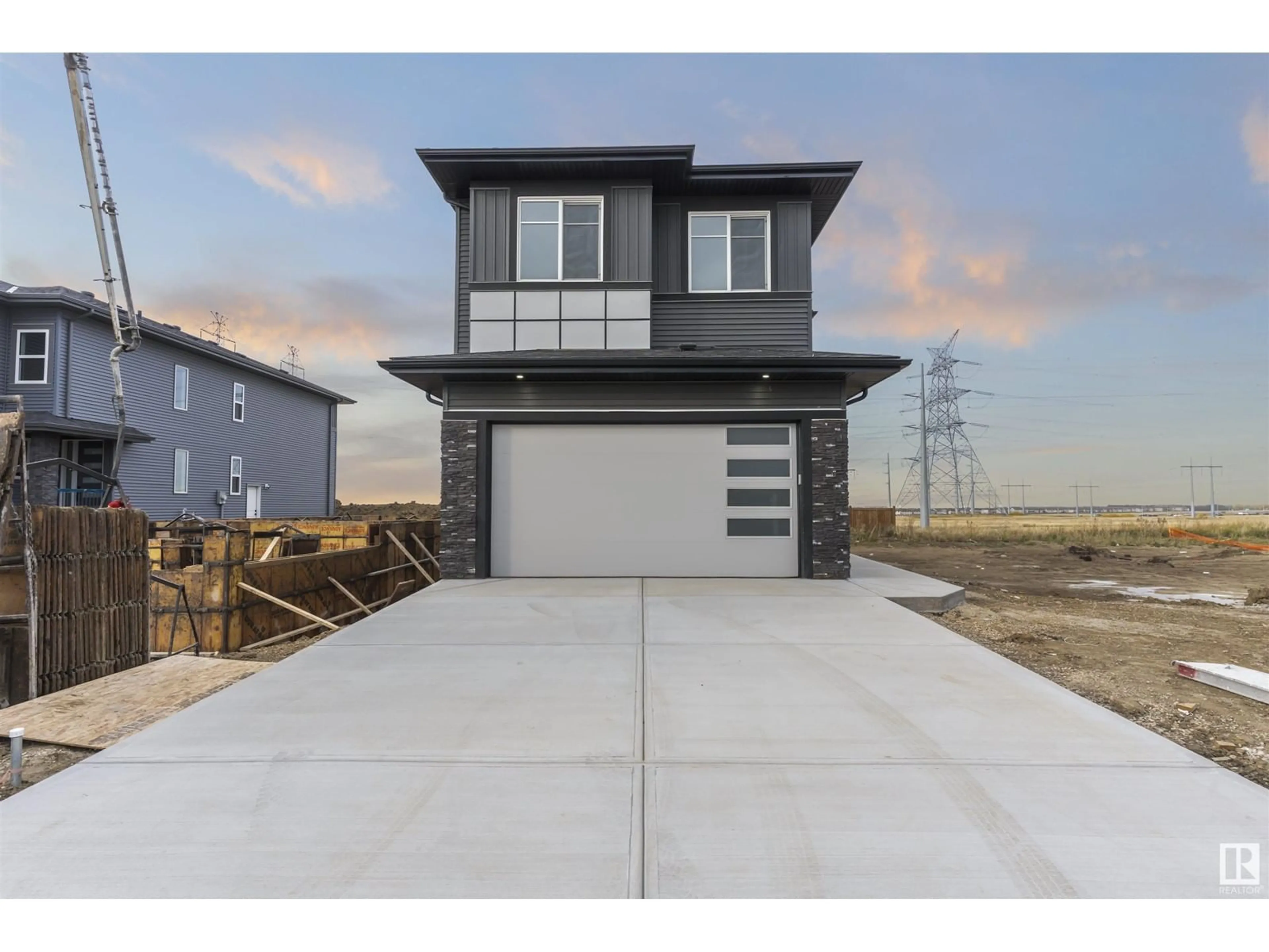 Frontside or backside of a home, the street view for 2748 1 AV SW, Edmonton Alberta T6X3E4