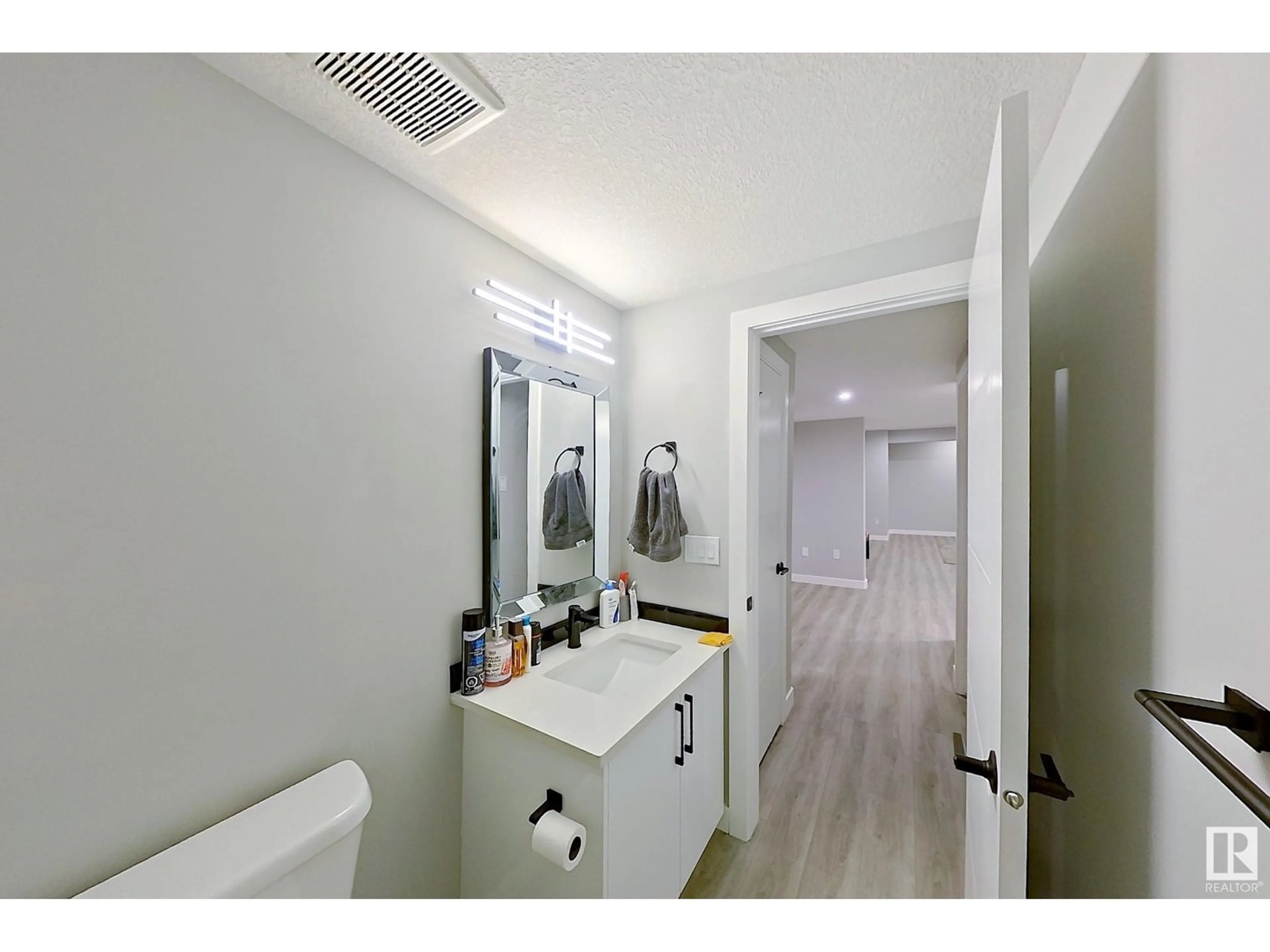 Standard bathroom, wood floors for 1027 150 AV NW NW, Edmonton Alberta T5Y4C1